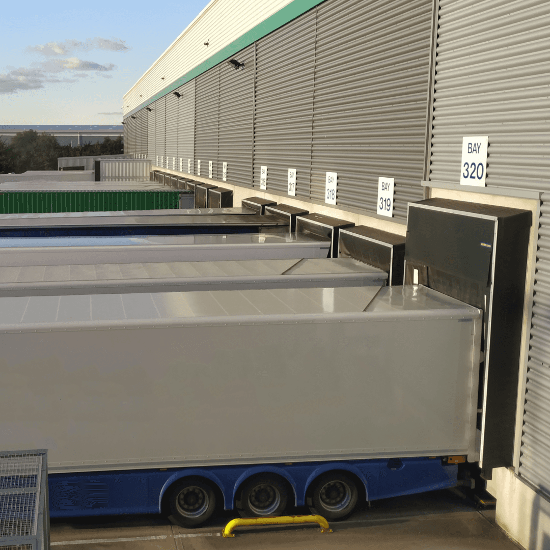 Warehouse trailers positioned at loading docks managed through yard management system scheduling