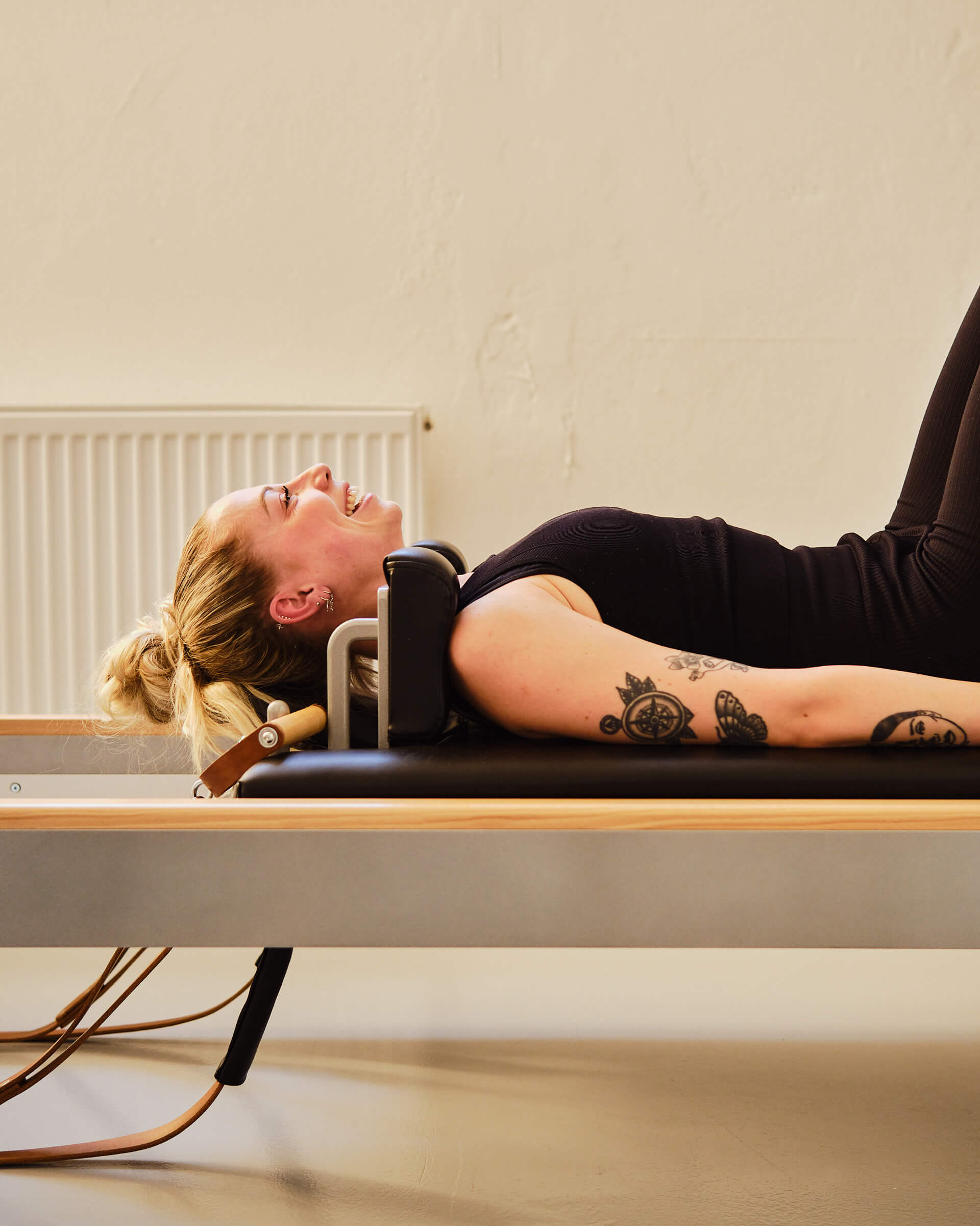 Instructor guides client on the reformer