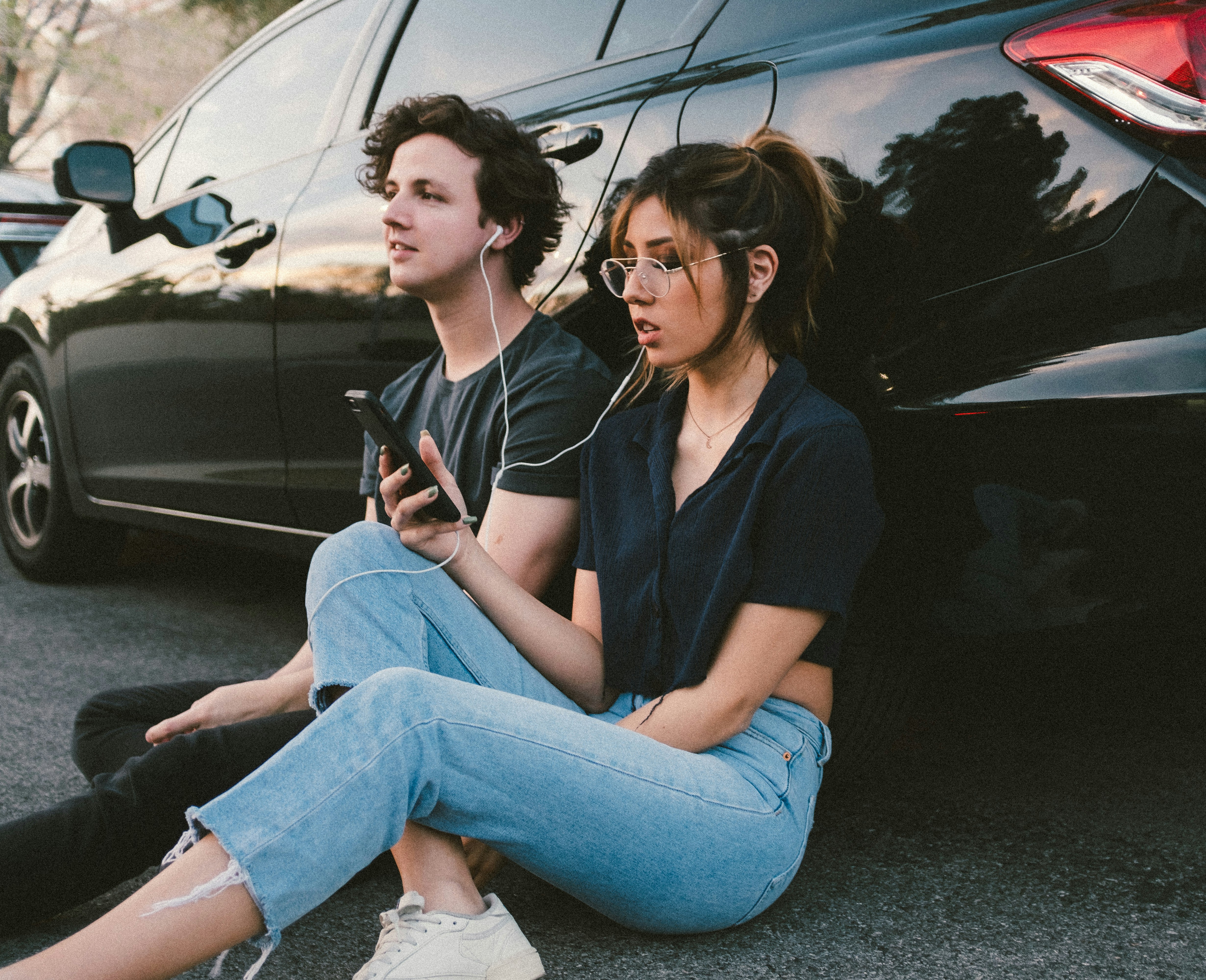 girl with a boy listening to book - How to Listen to Audiobooks