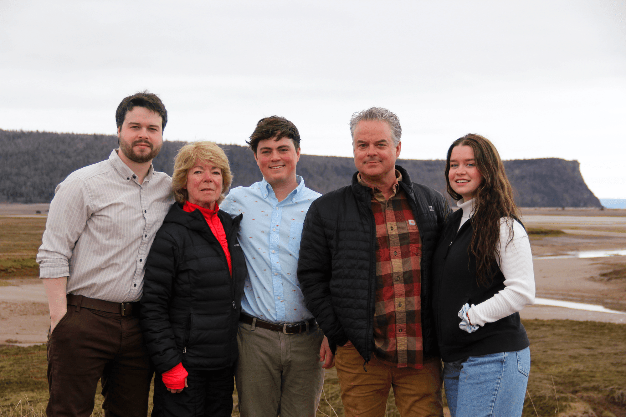 a family of four on a beach