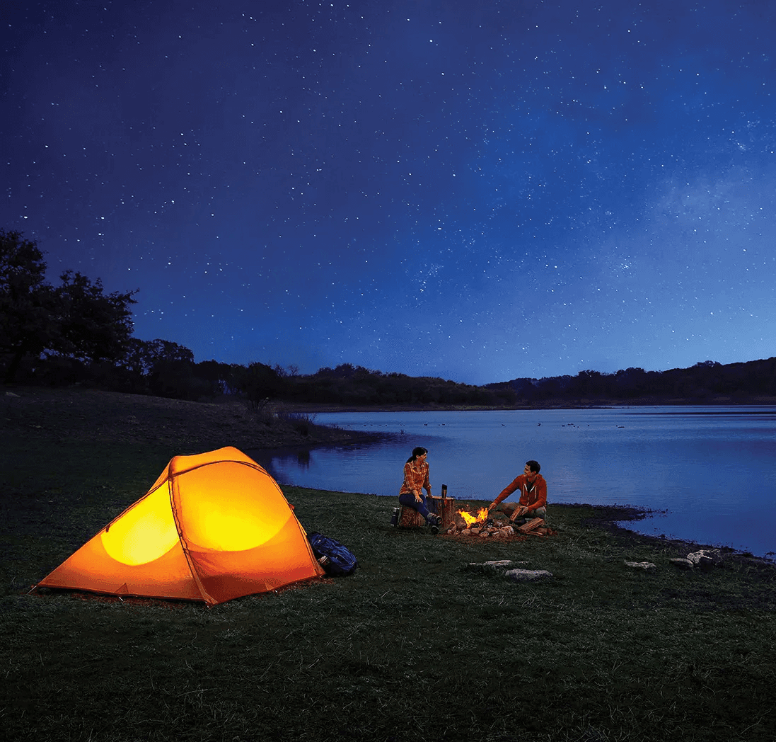 Couple camping at night