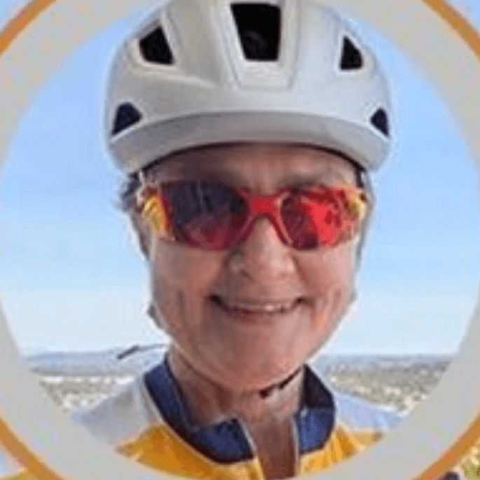 man wearing eyeglasses and blue shirt inside coffee shop
