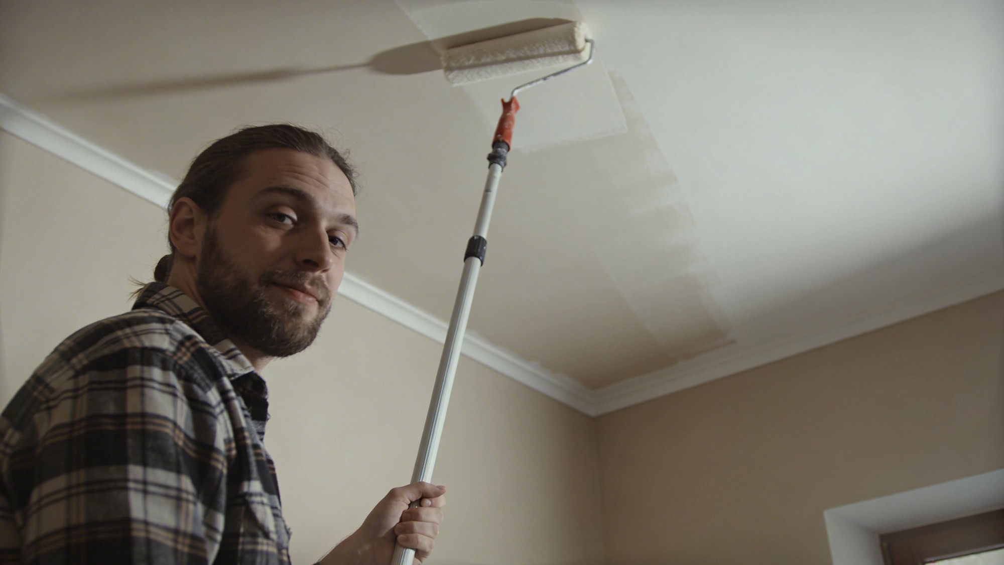 Overhead view of densely packed buildings in hazy atmosphere.
