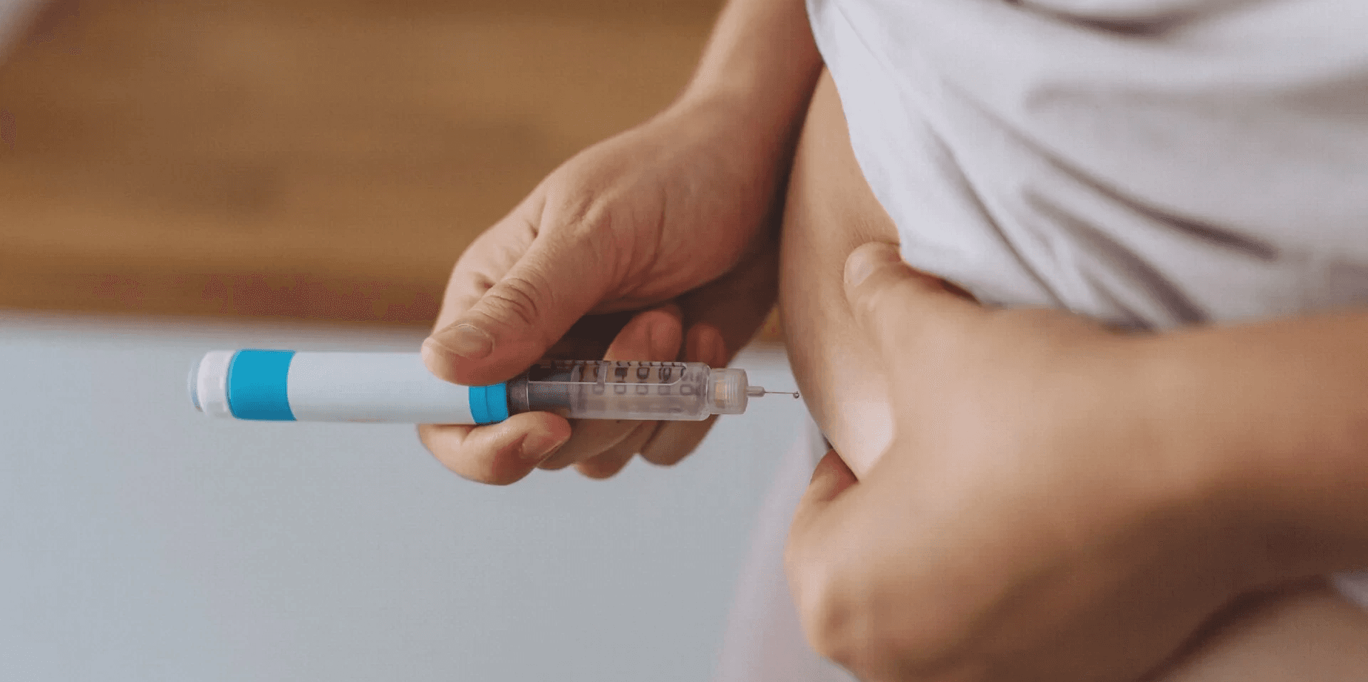  Person injecting medication into their abdomen - How to Inject Semaglutide