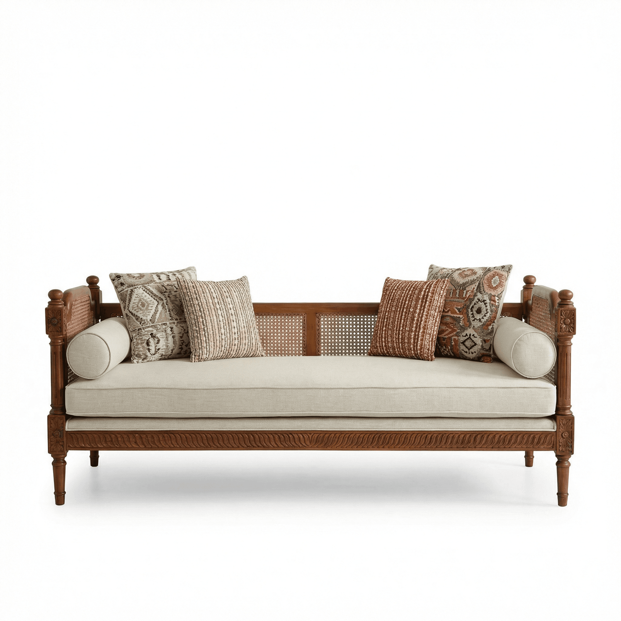 Three‑seater wooden daybed with cane backrest, upholstered seat, and patterned cushions