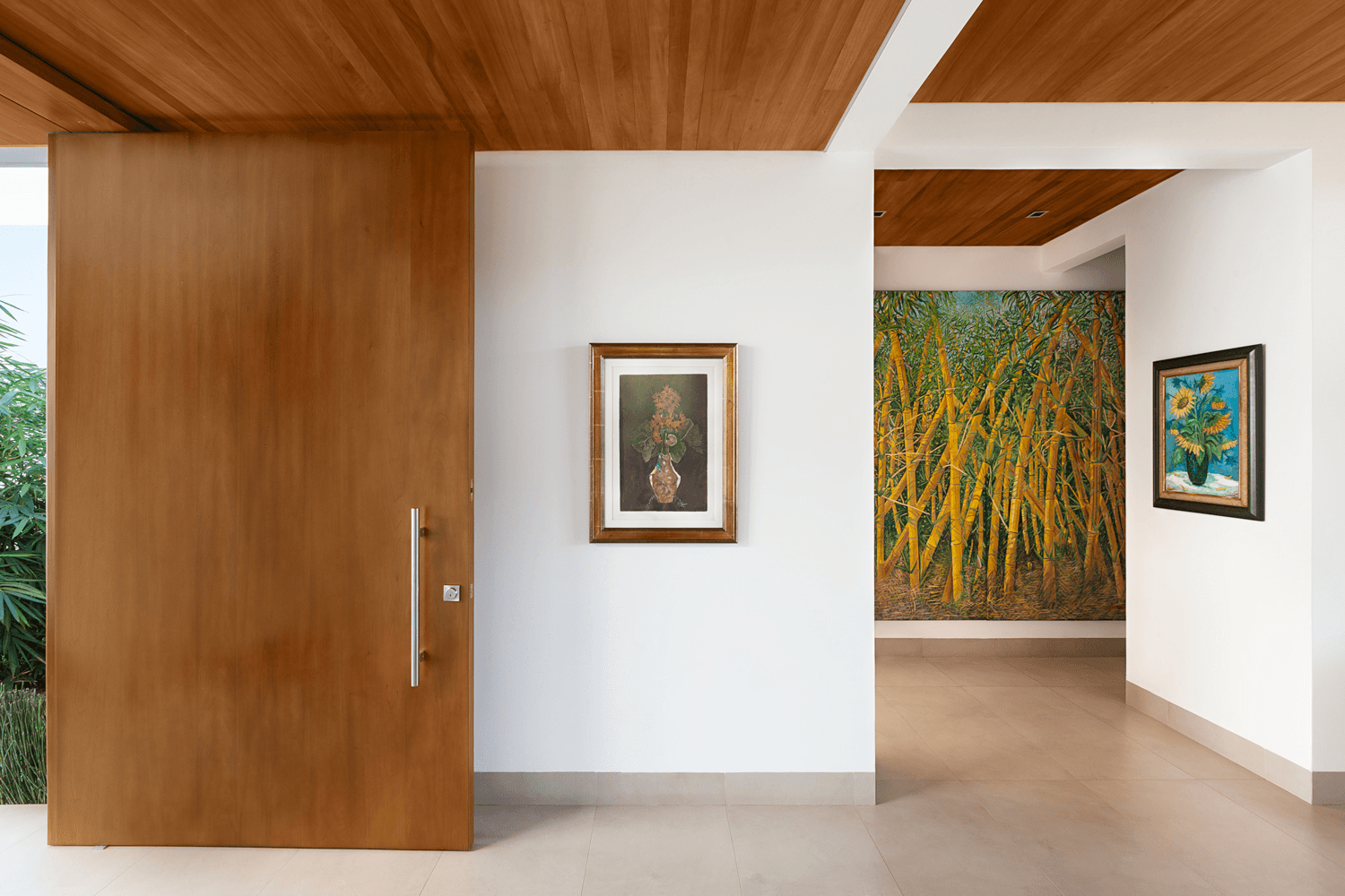 Floor-to-ceiling glazing with courtyard views and timber interior — RA House by Hurtado Arquitectos
