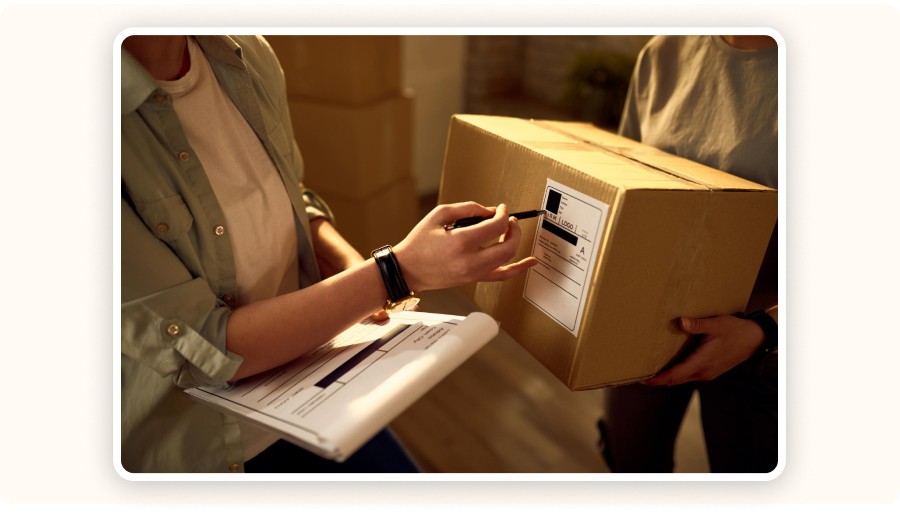 Person checking a shipping label.
