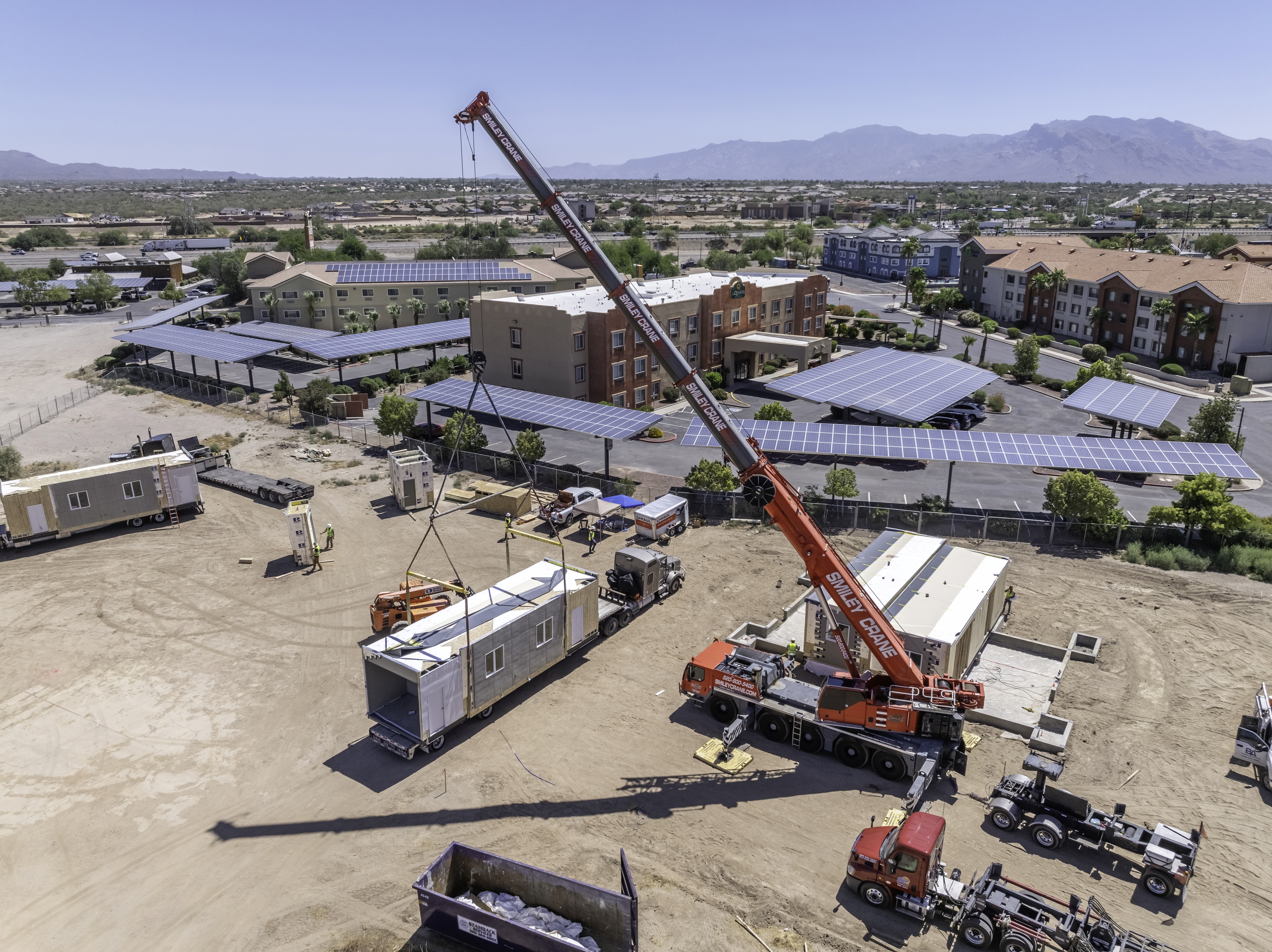 A crane moving a modular unit.