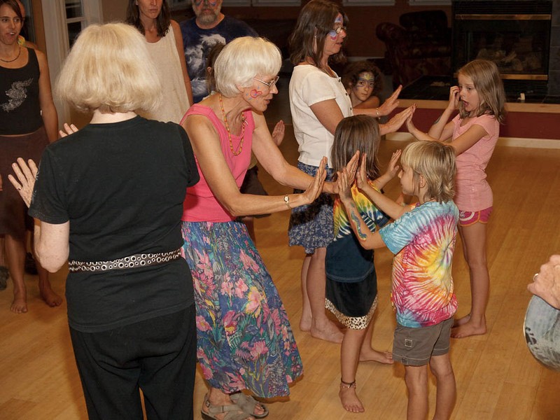 People of different ages gathered together in a shared community space.