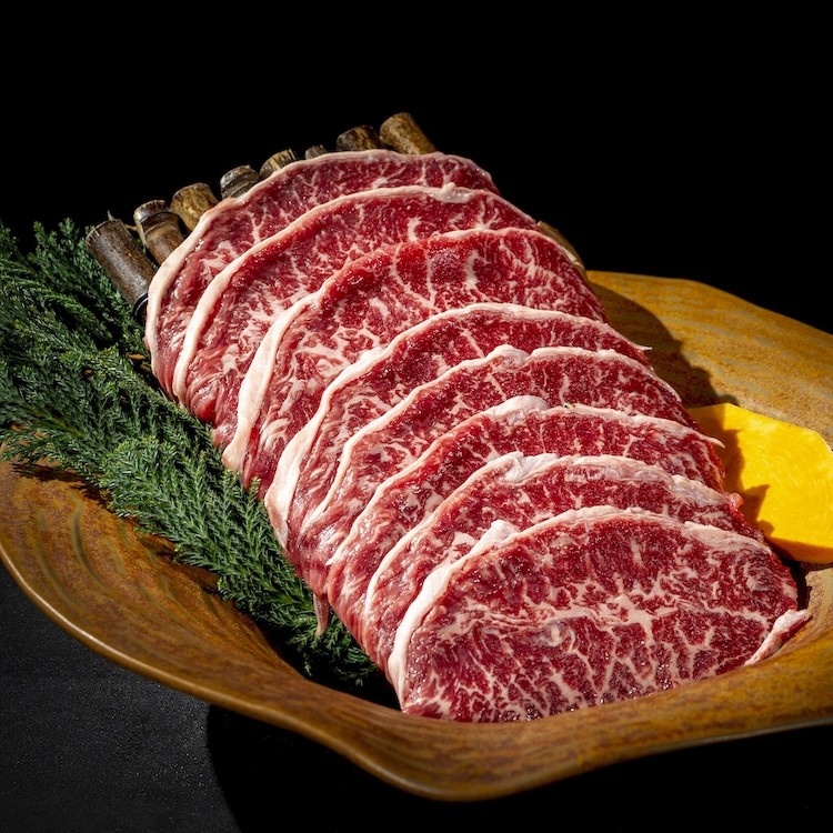 a person is grilling some food on a grill