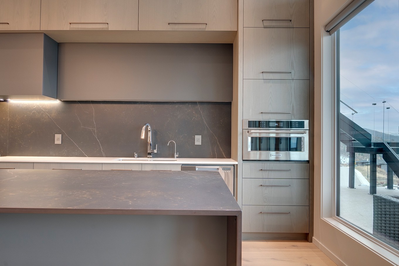 Minimalist kitchen with sleek cabinetry and integrated lighting