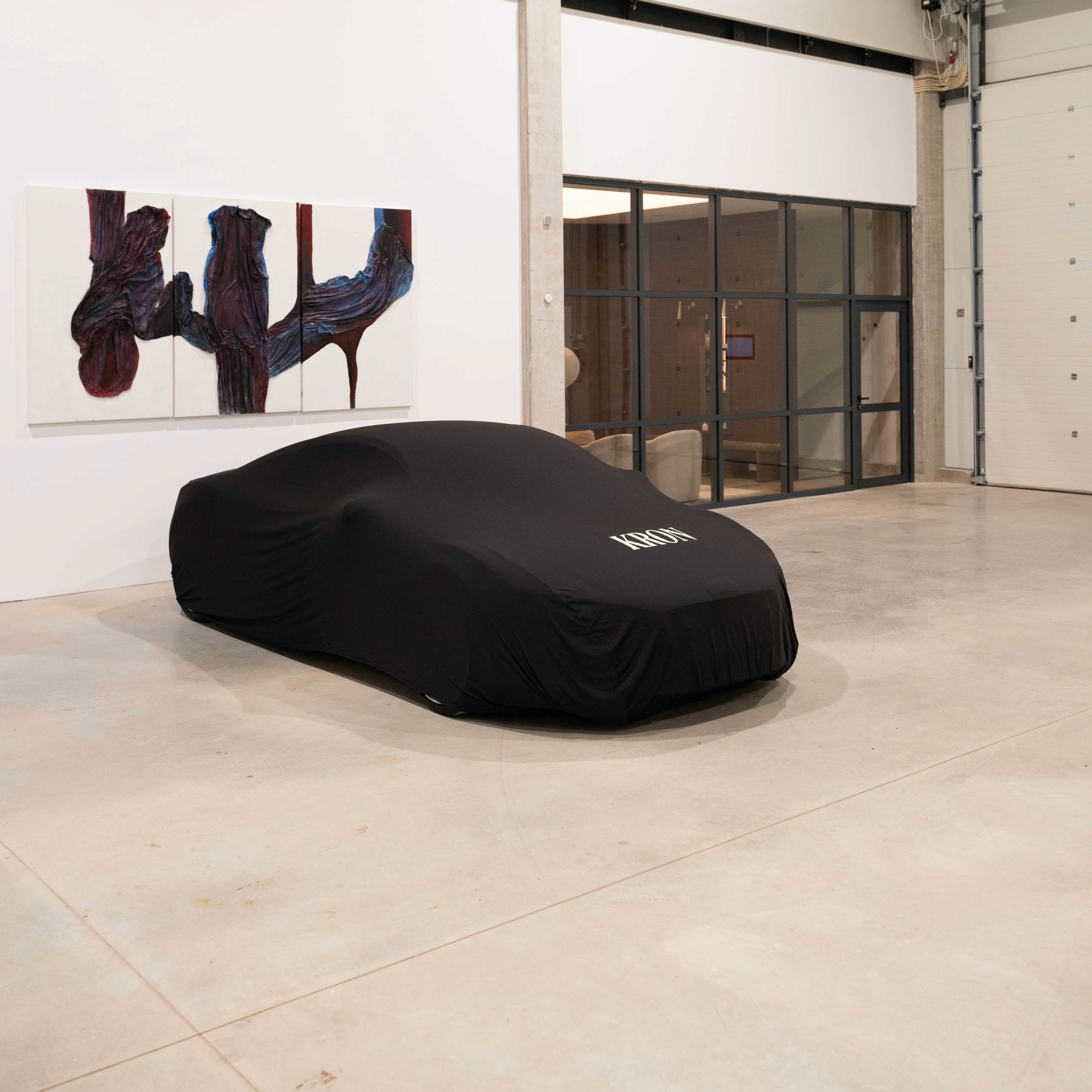 Luxury BMW in a modern premium indoor showroom with soft lighting and polished floors.