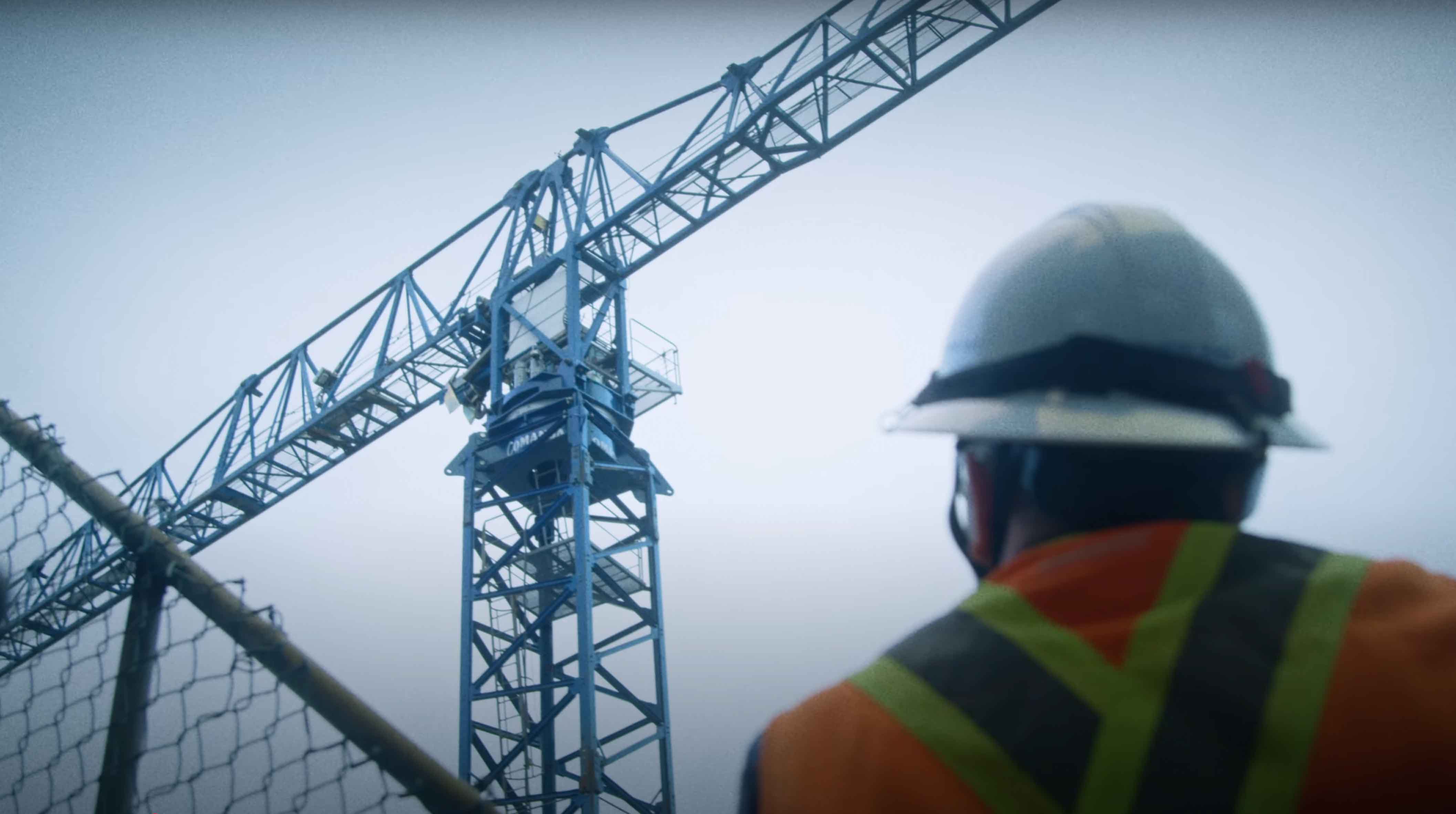 woman in black blazer smiling