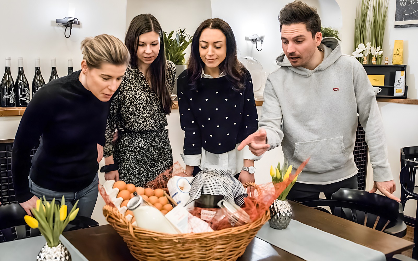 Participants examining ingredients for Kaiserschmarrn cooking class.