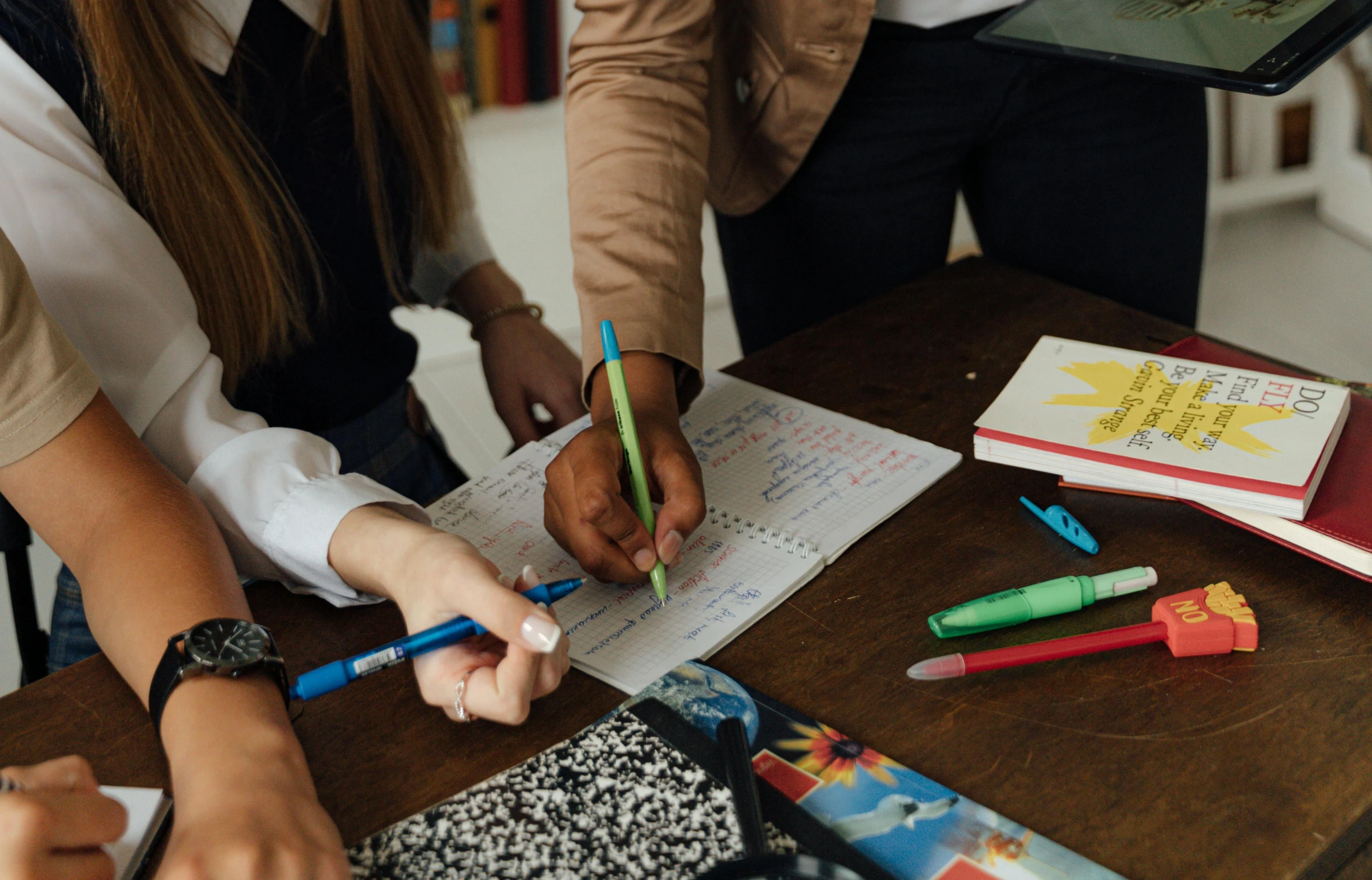 teacher helping student with work