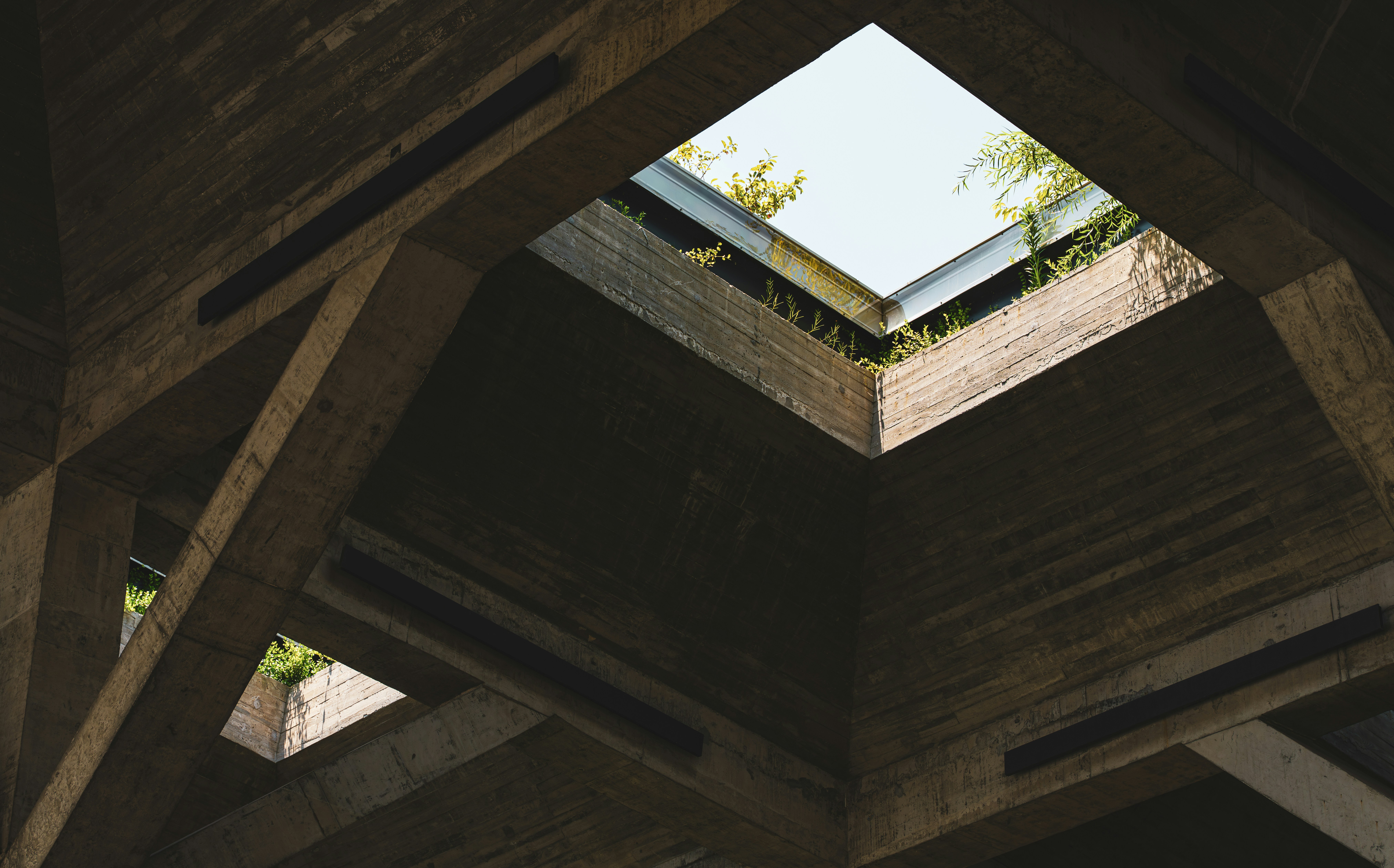 High-resolution interior material detail with stone, timber, and natural light