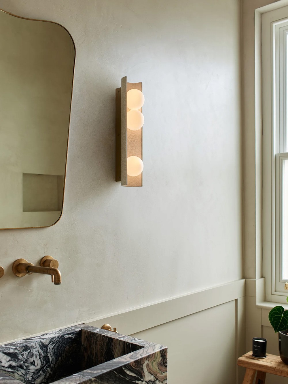 Lena wall light – frosted glass globes within curved ceramic shade in Ivory Crackle glaze