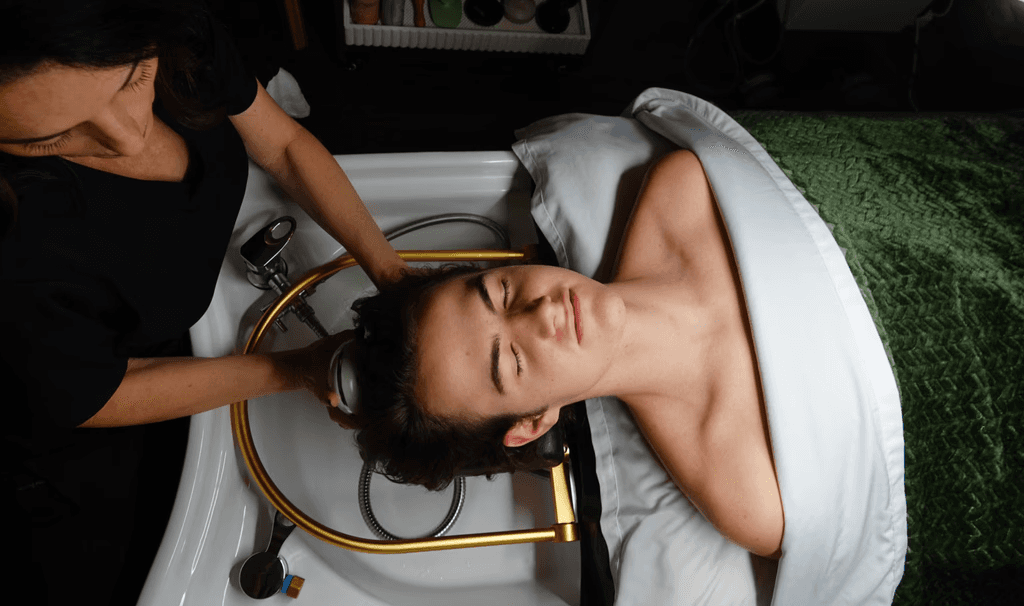 Man getting a scalp treatment