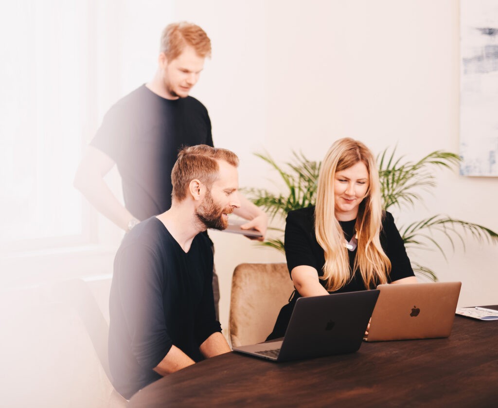 space black case Apple Watch, silver MacBook Pro, jet black iPhone 7 Plus, and silver iMac with corresponding boxes