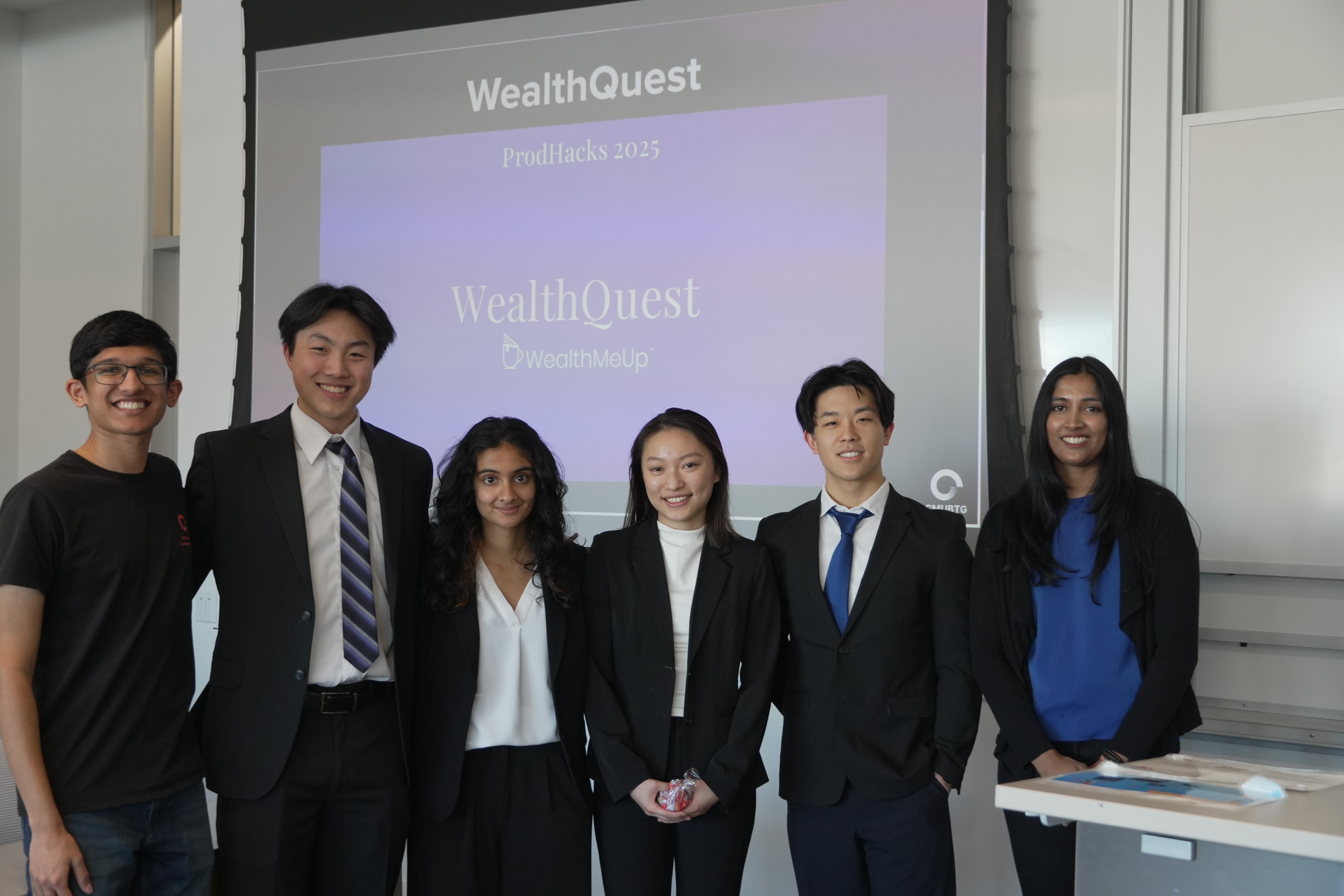 person discussing while standing in front of a large screen in front of people inside dim-lighted room