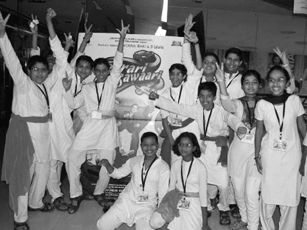 Group of people relaxing outdoors on a field or lawn