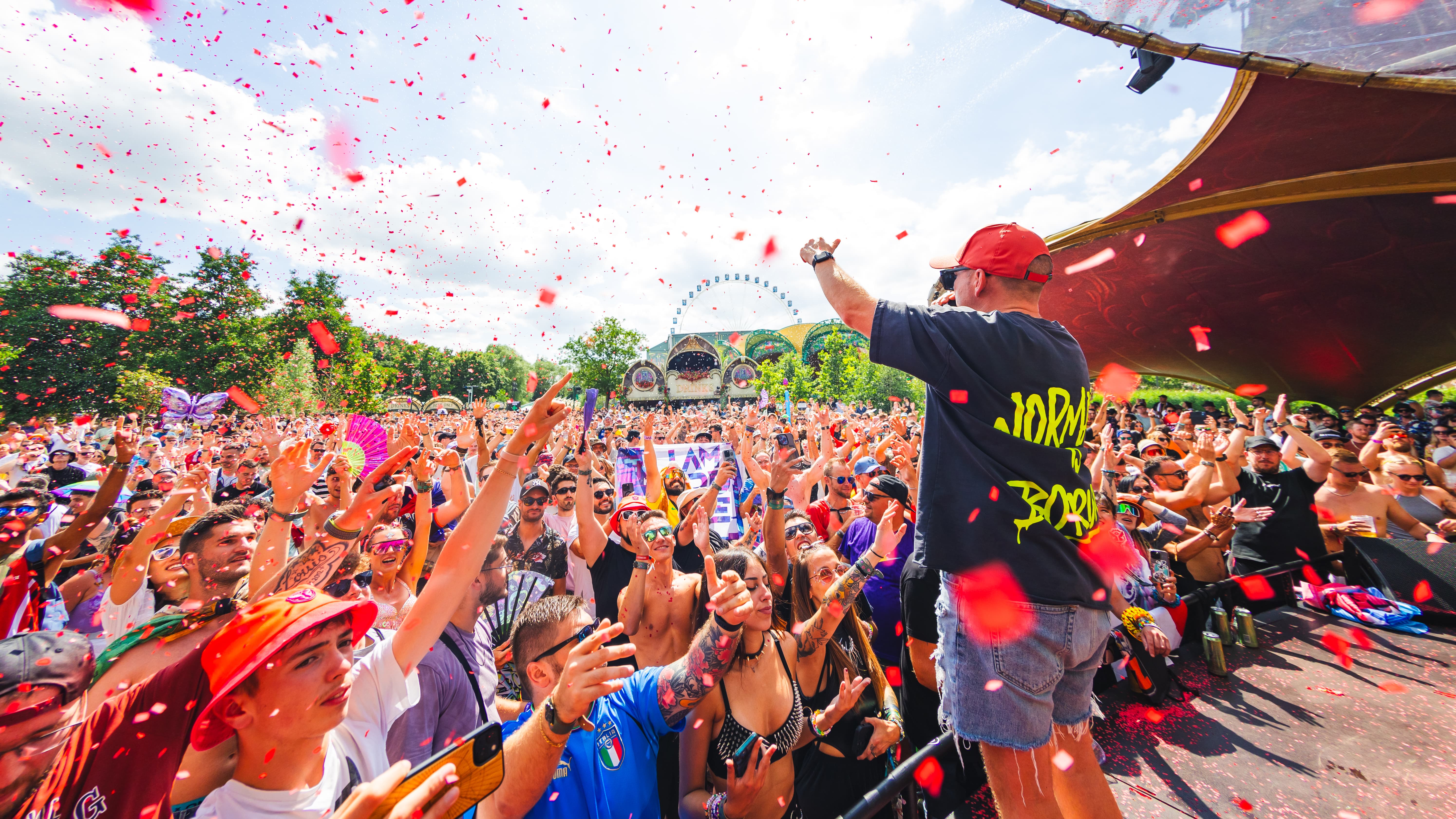 MC Villain at The Rose Garden at Tomorrowland with confetti and engaging crowd