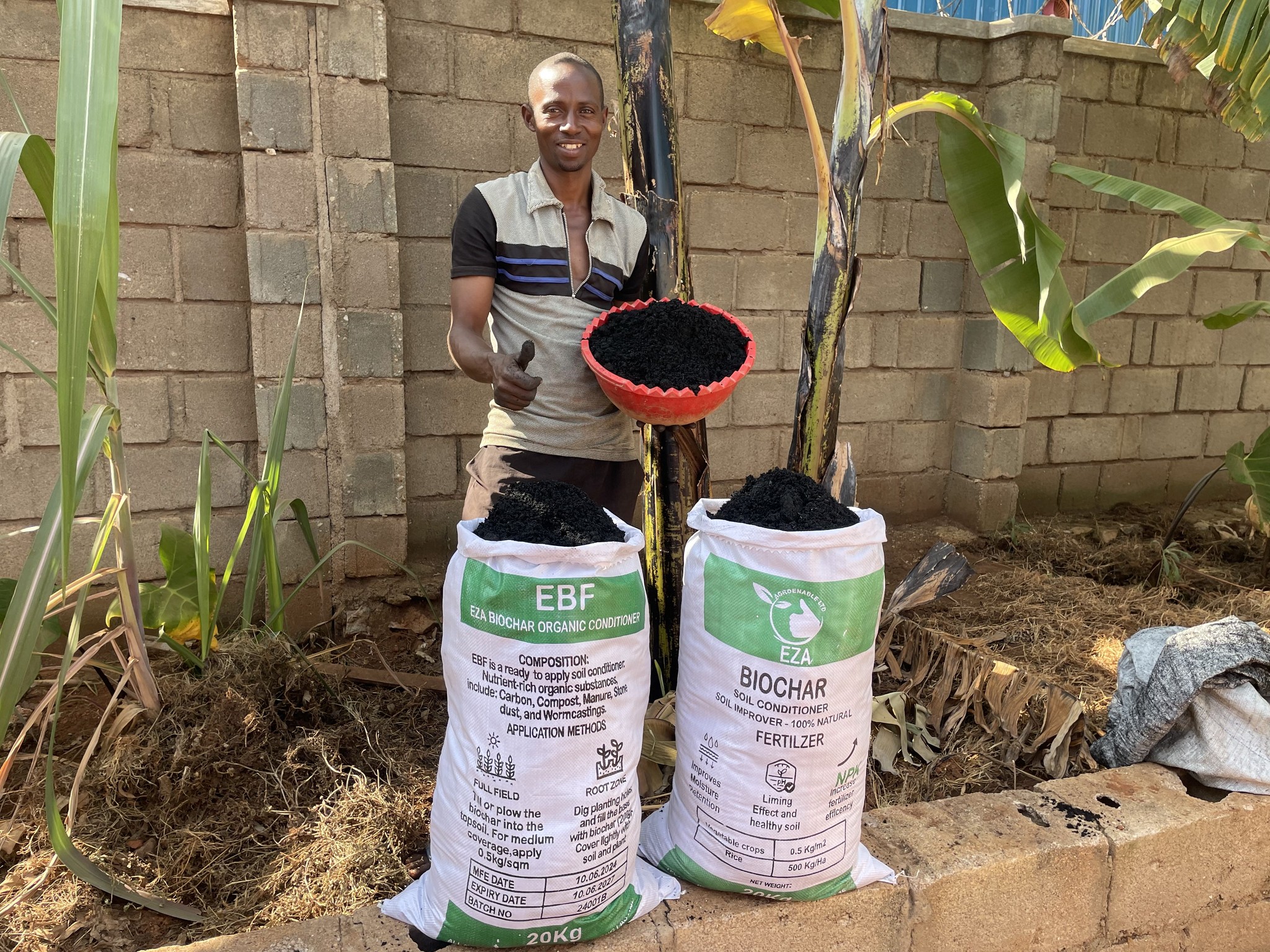 Image showing farmer with biochar and biocharcoal