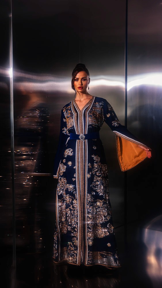 Black Moroccan caftan with gold hand embroidery, elegant handcrafted couture piece prepared in Bahrain