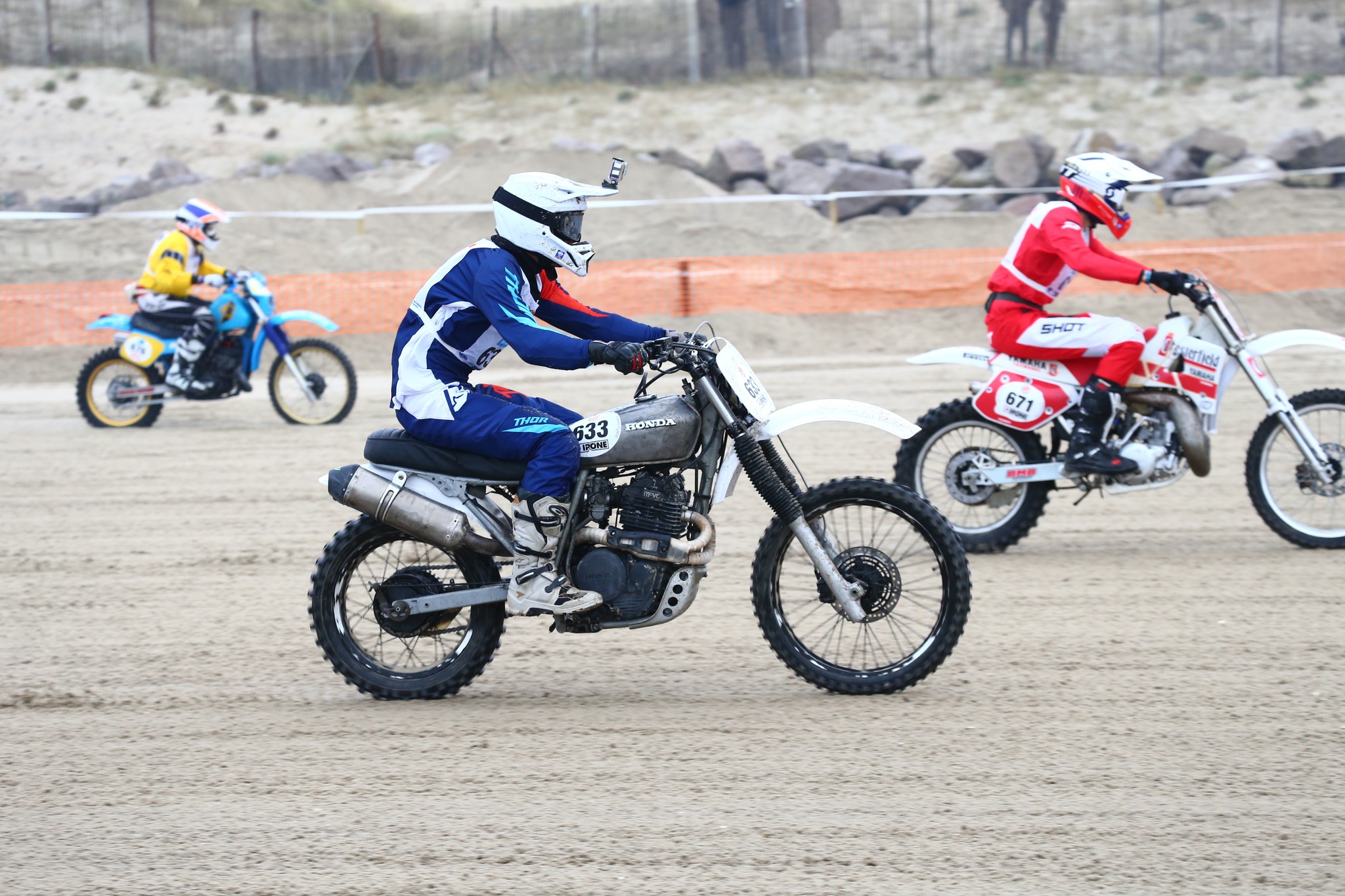 Group of people relaxing outdoors on a field or lawn