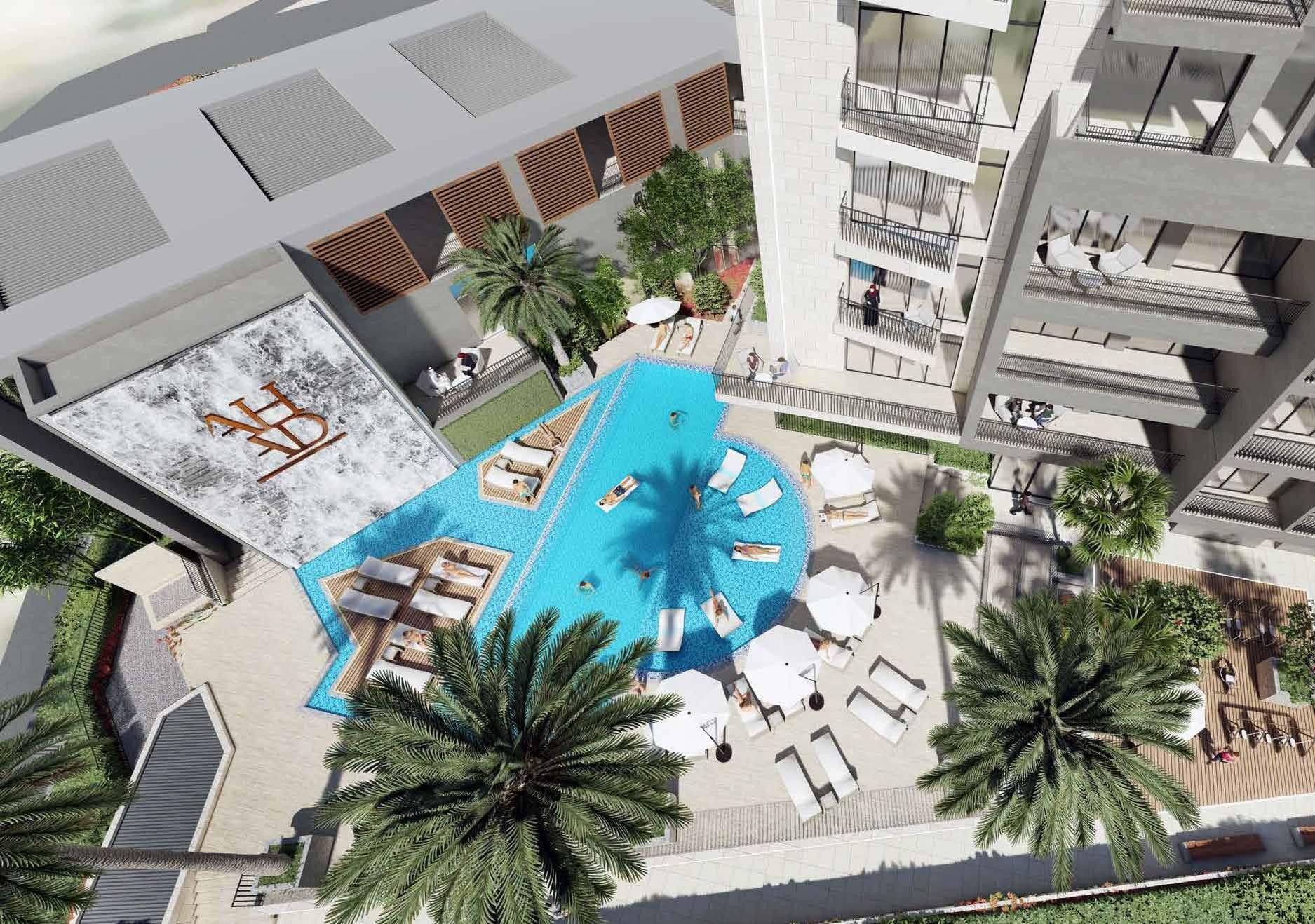 Aerial view of a luxury pool area with palm trees, offering high-end amenities for real estate investors.