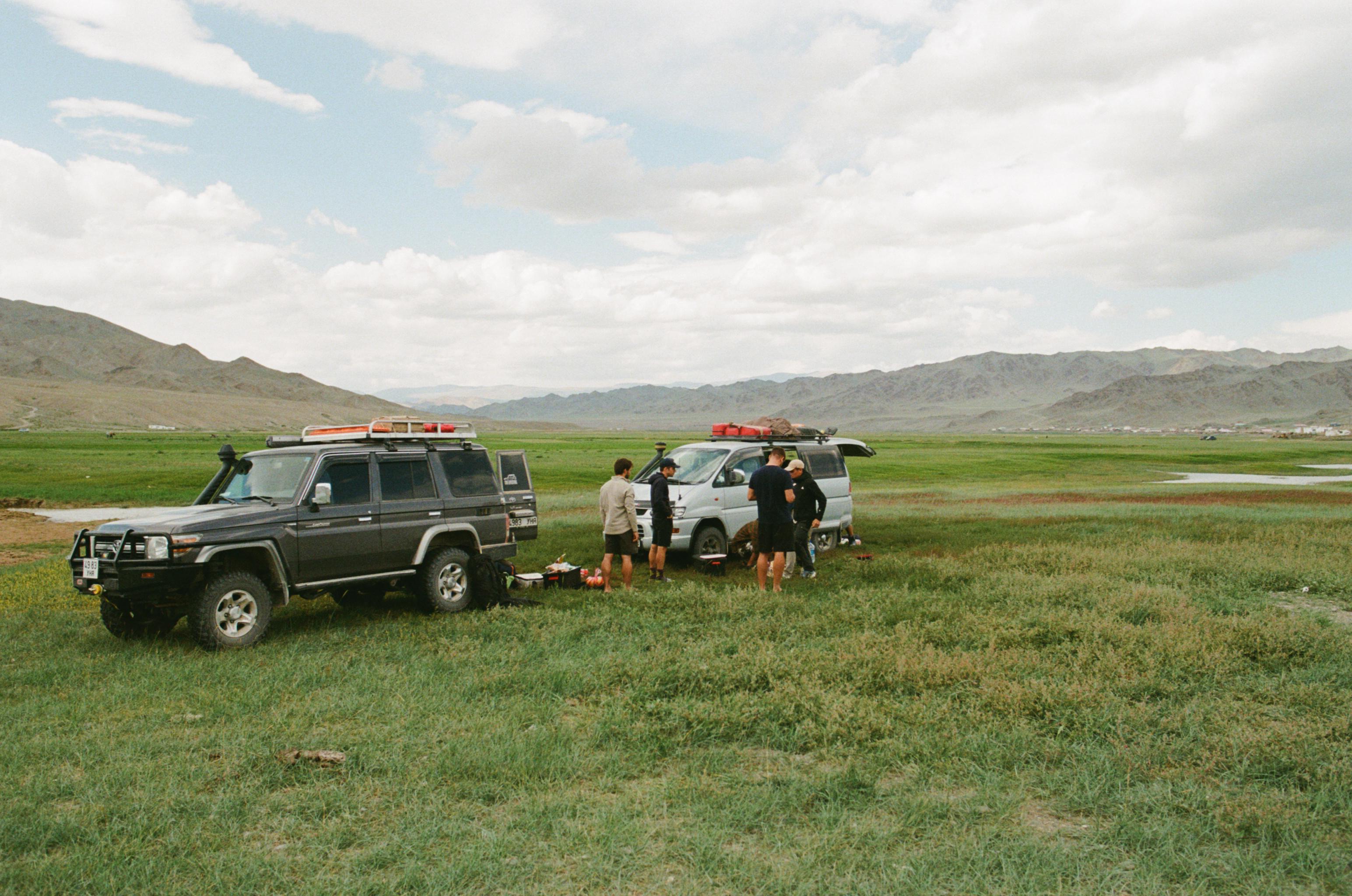 off-road cars with tourists on adventure in Mongolia