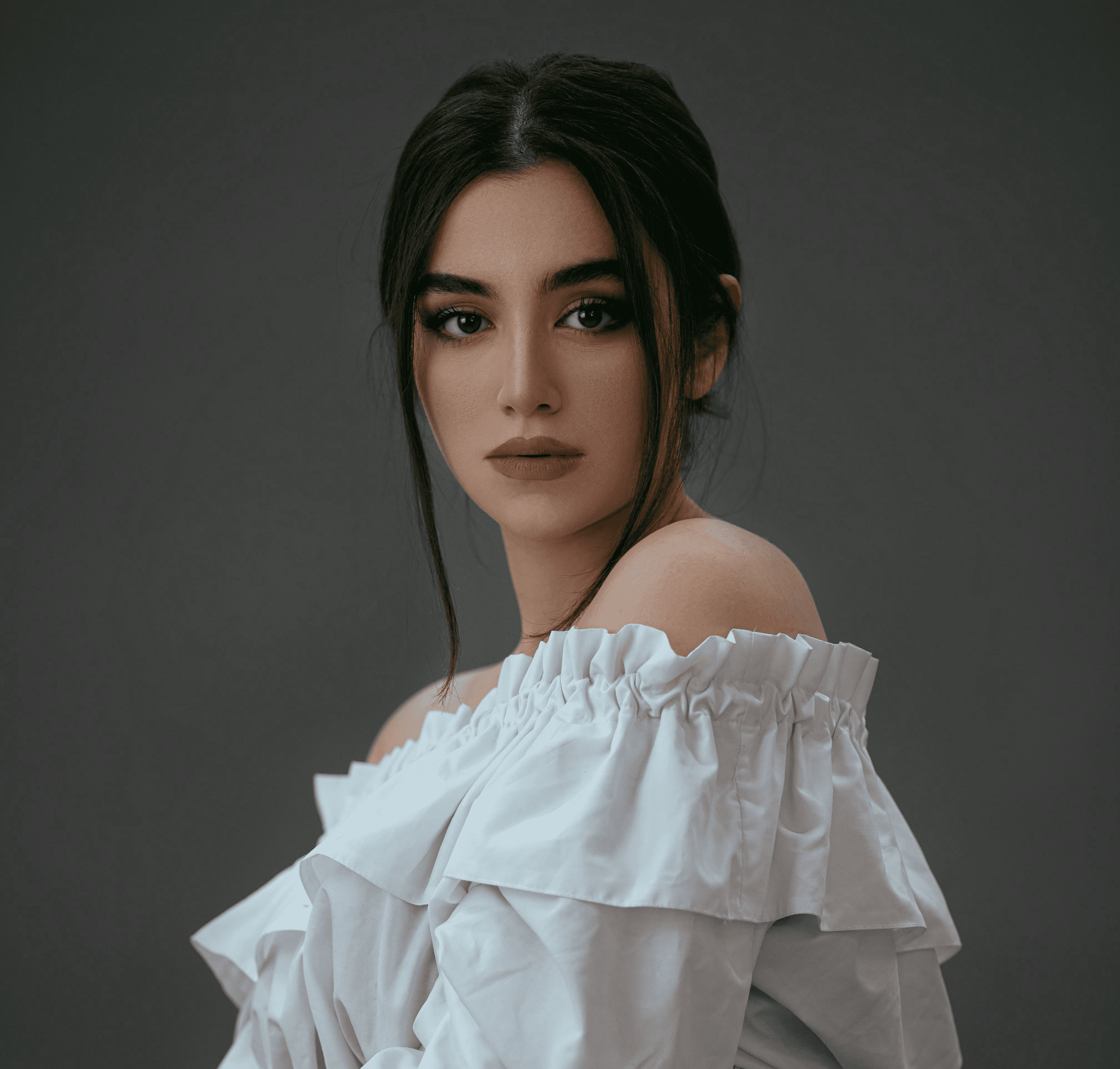 woman in white off shoulder dress