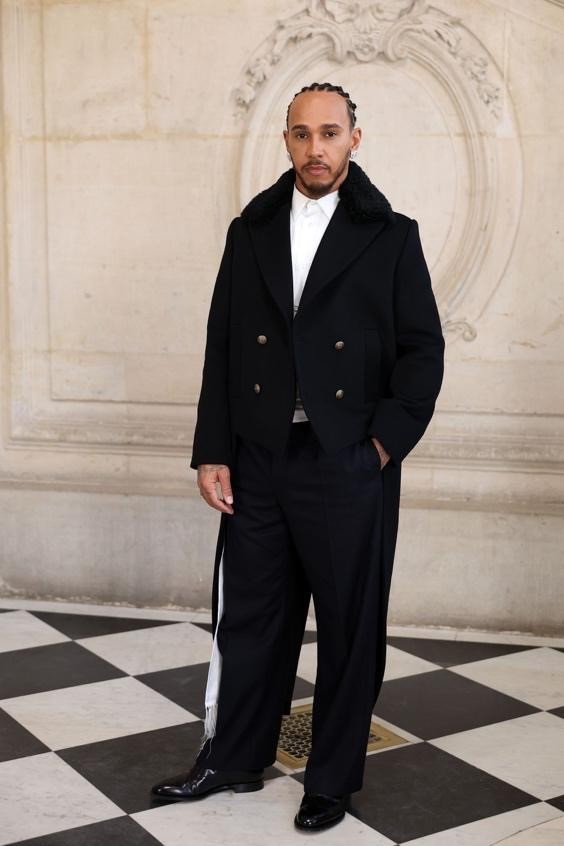 Image may contain Lewis Hamilton Clothing Coat Blazer Jacket Person Standing Adult Formal Wear Suit and Overcoat
