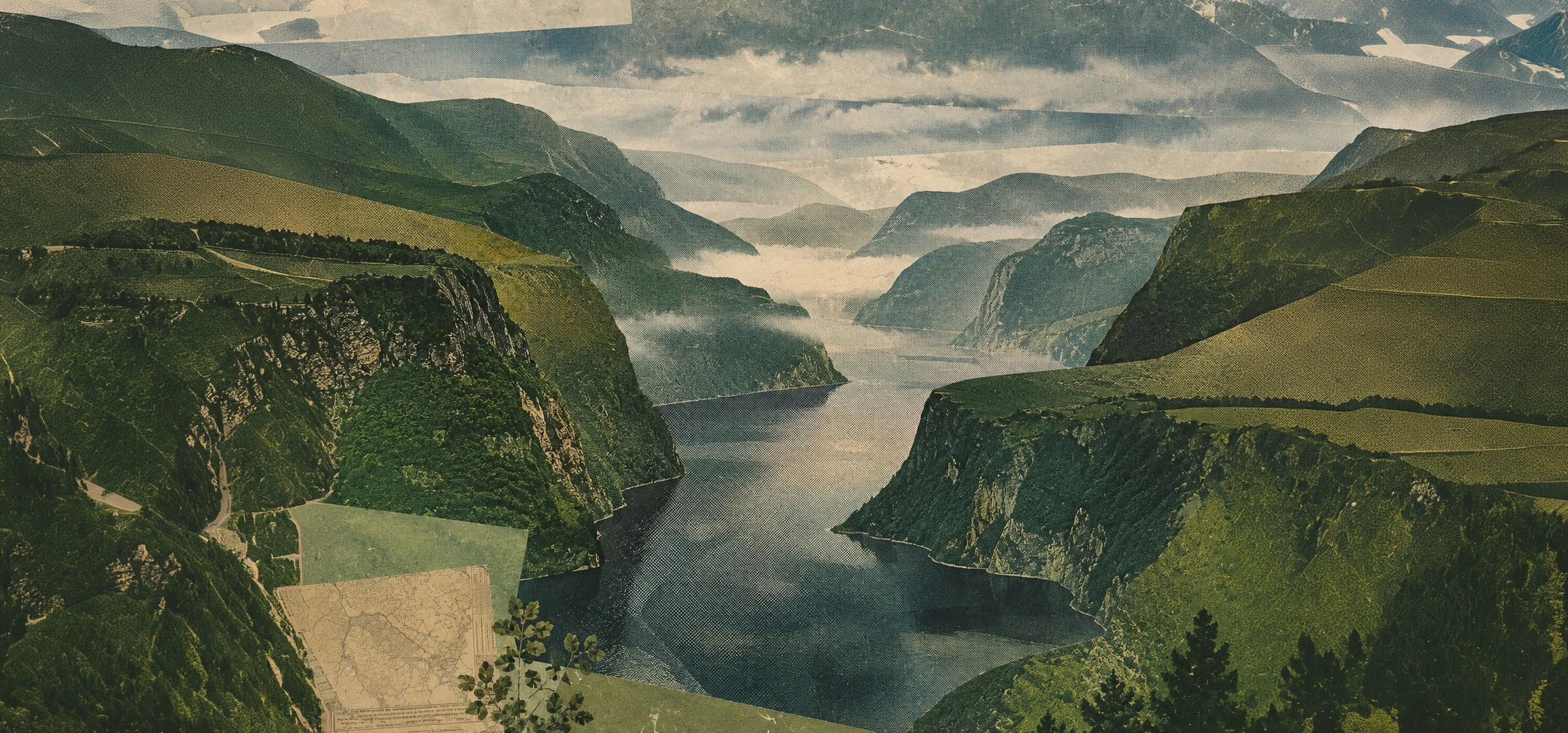 Misty fjord winding between steep, green mountain cliffs