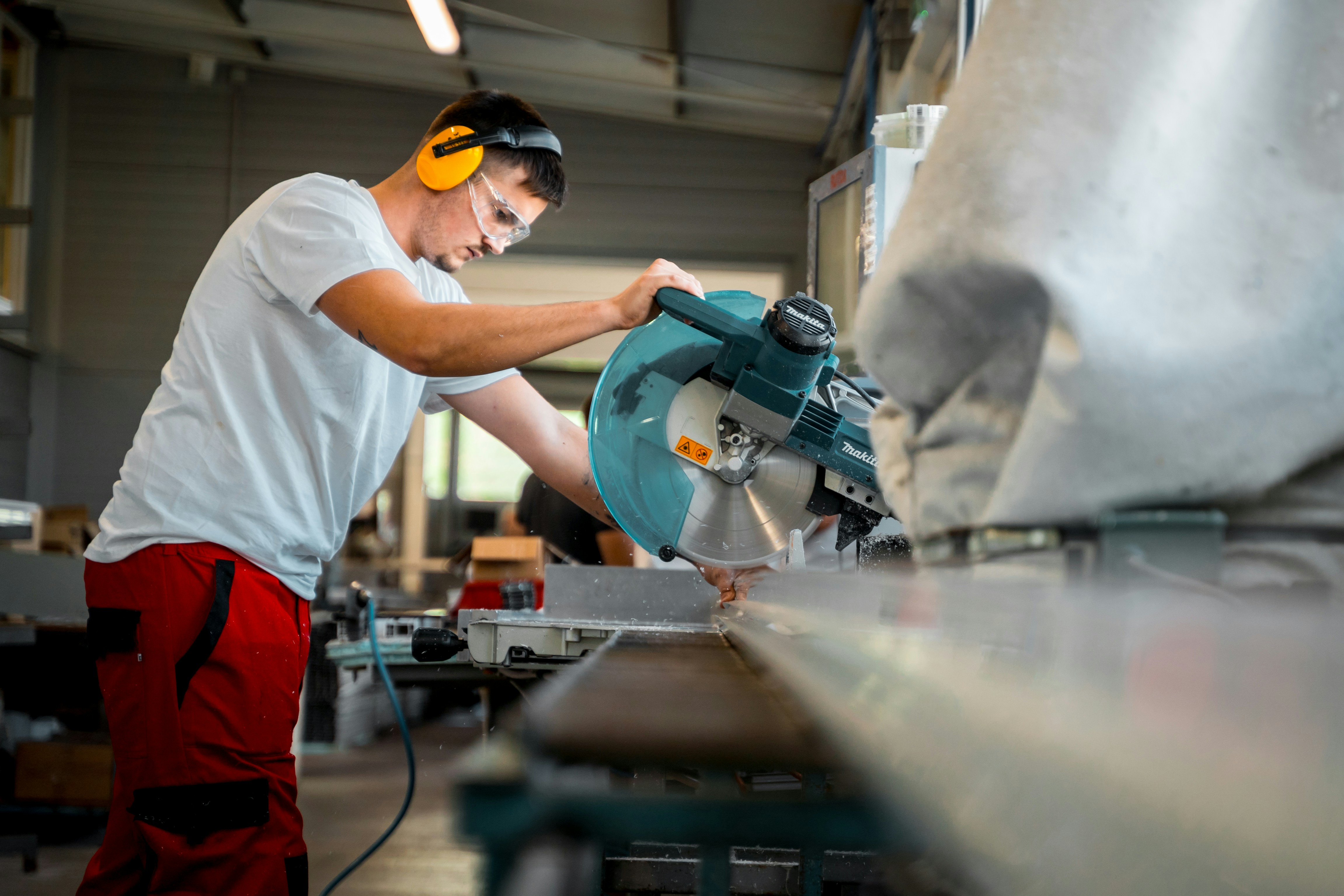 A man working on a machine in a factory