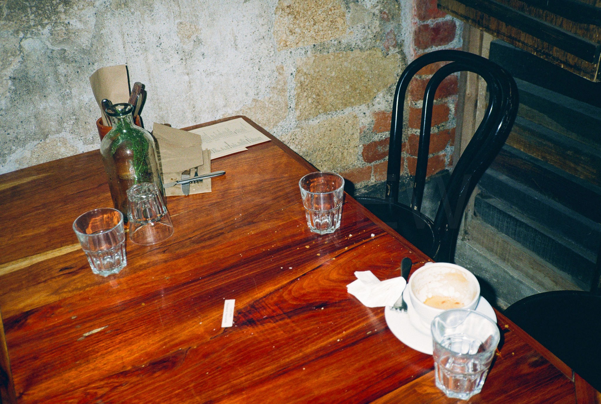 Modern skyscrapers line a busy highway in a sprawling city.