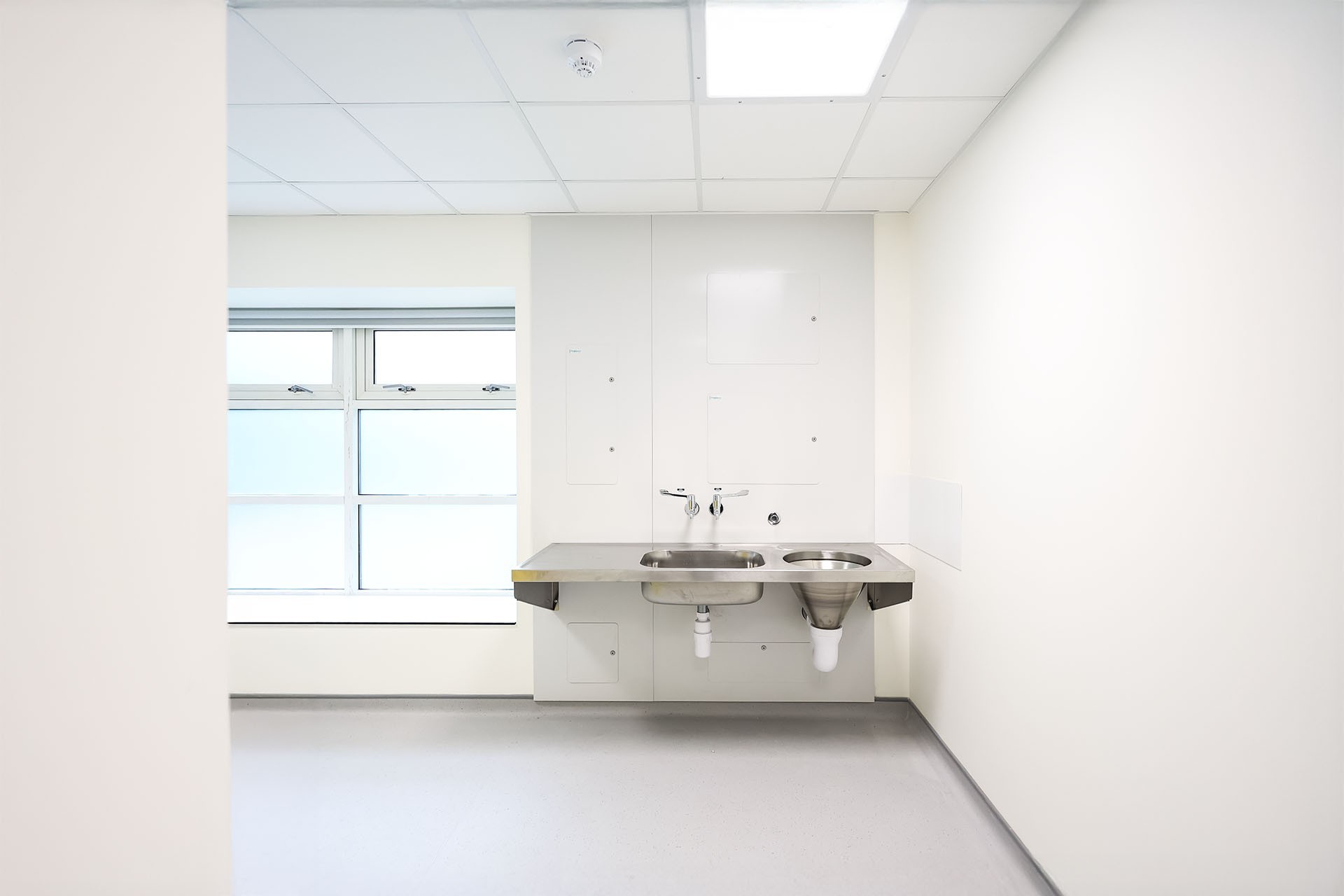 The Slophopper IPS (integrated plumbing system) installed in a White finish