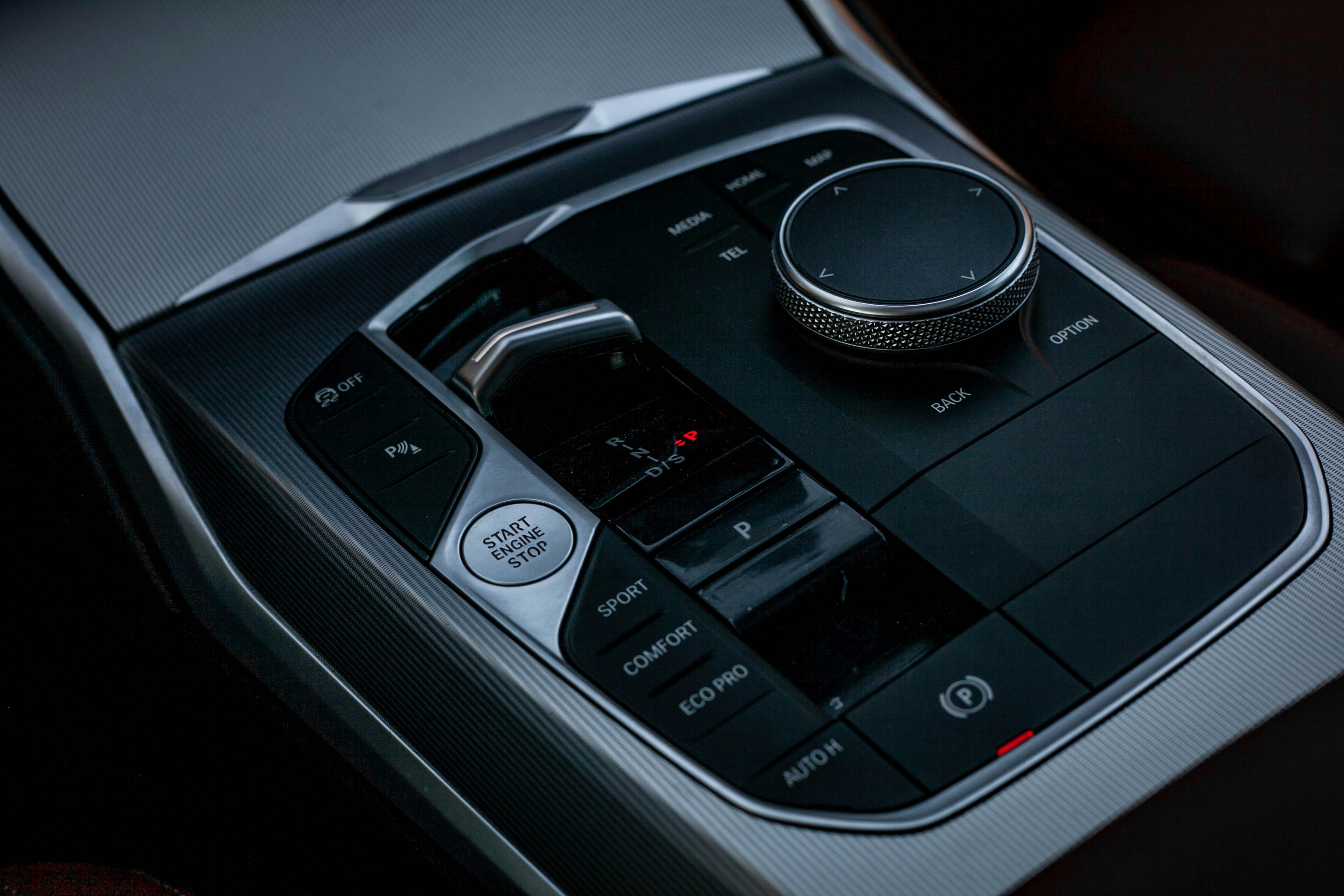 Close-up of modern car's center console controls.
