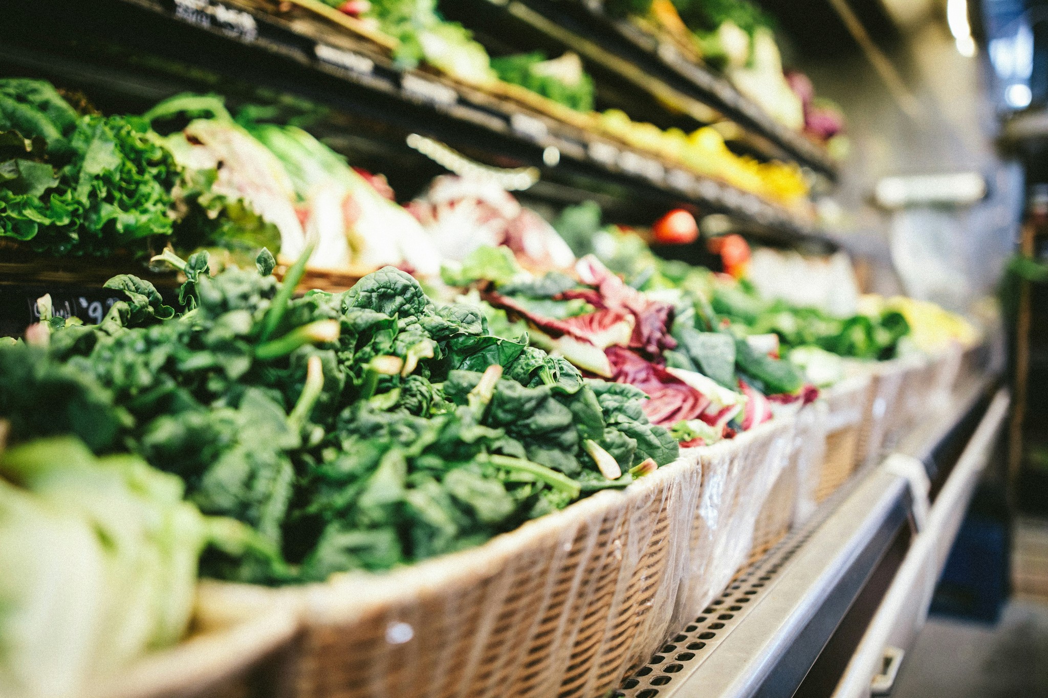 Fresh leafy greens and vegetables displayed at International Food Market Orlando, offering a wide variety of fresh produce for the local community in Orlando, Florida.