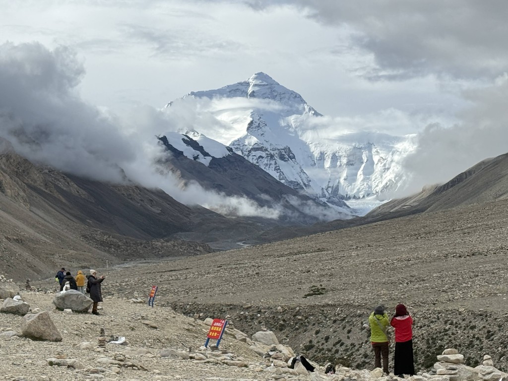 a view of a city and mountains from a distance