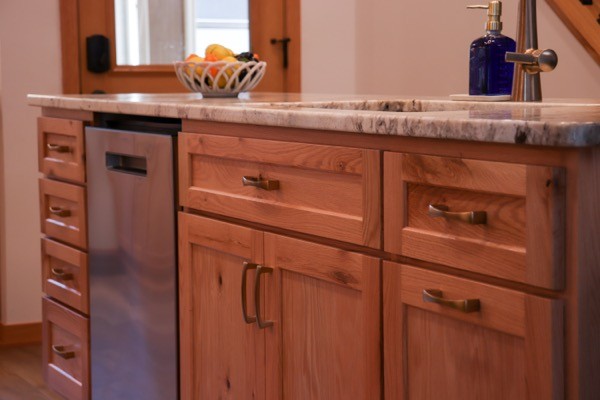 Light natural kitchen cabinet island with dishwasher quartz countertops