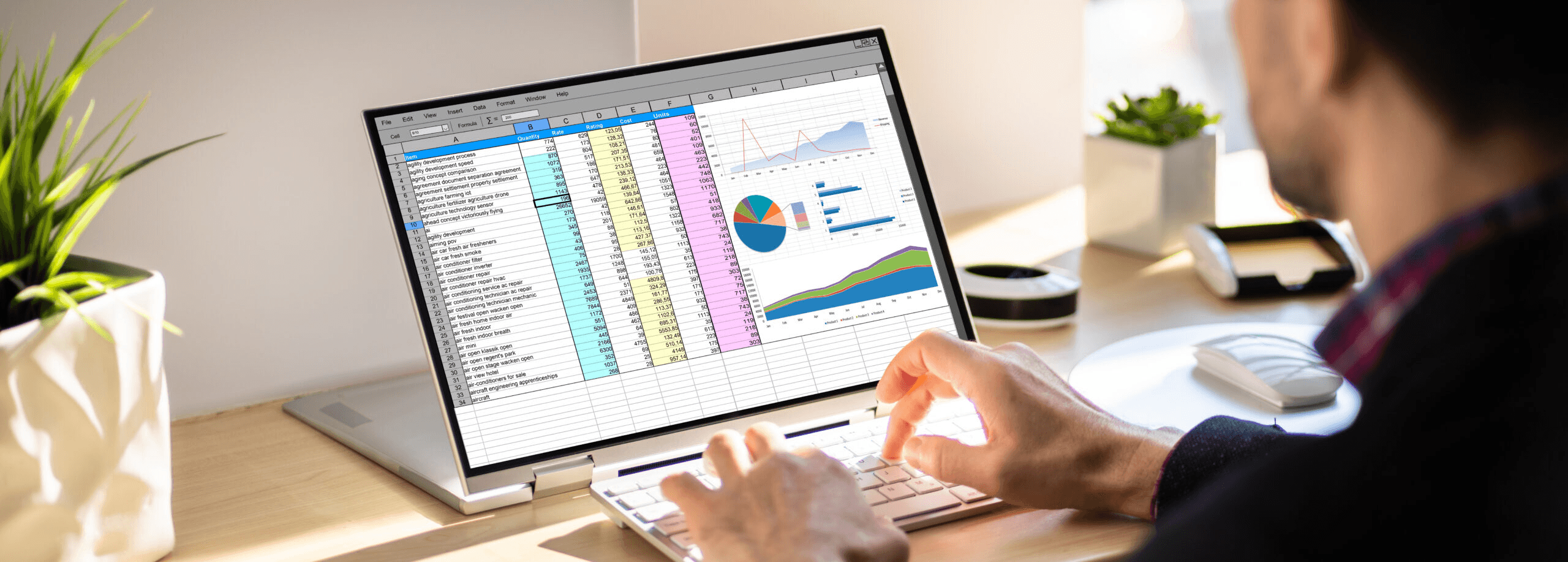 Man typing data into laptop spreadsheet - Data Validation Excel