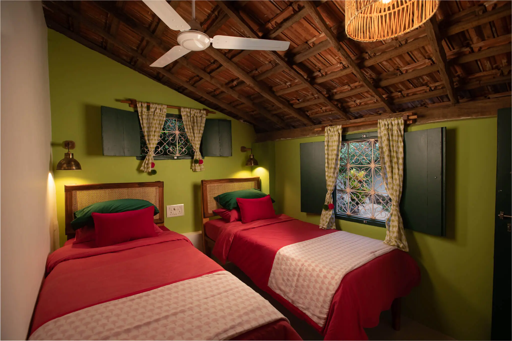 Heritage Seaside Cottage at Casa Jaali — twin beds under the old thatched roof