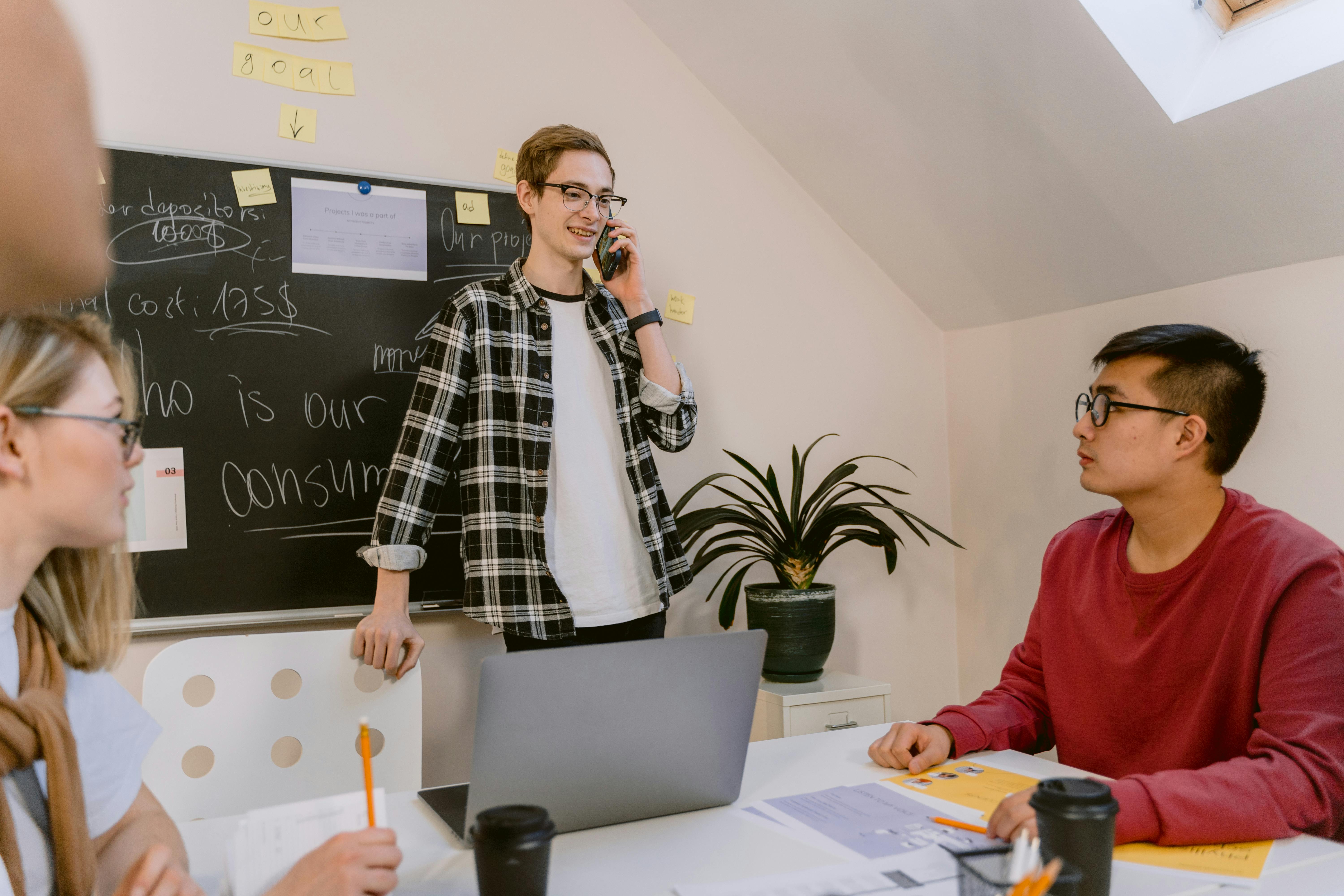 Man talking on the phone about optimal cold email length for success discussing tips and tricks