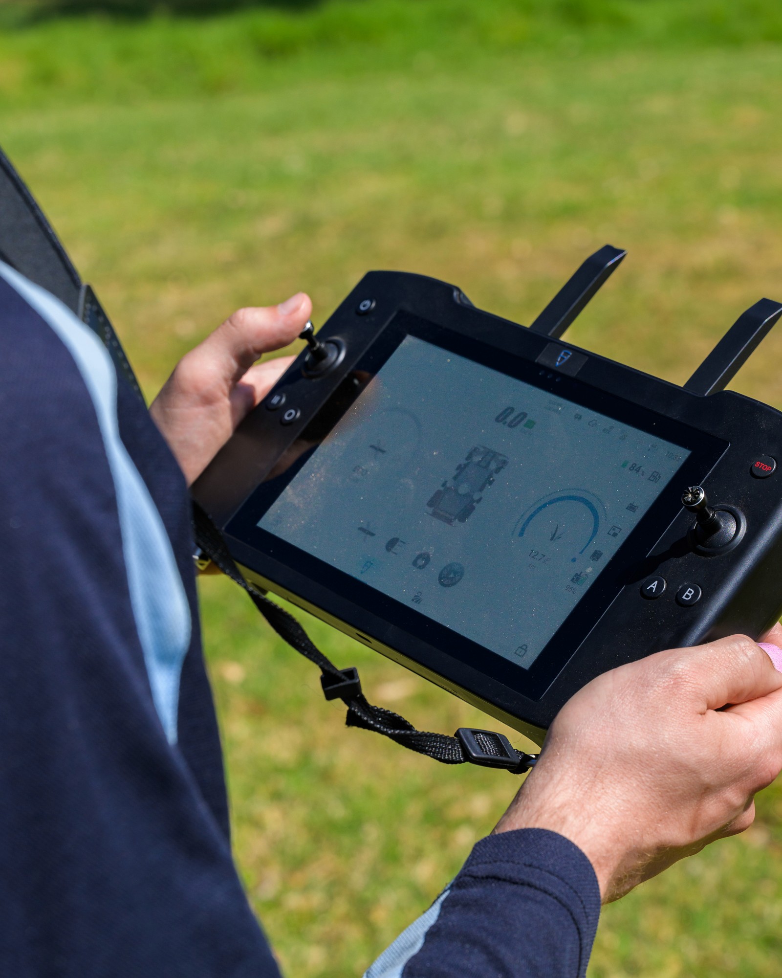 Aerial shot of an FJ Dynamics robot mower, mowing field at Macarthur Memorial Park in Campbelltown NSW.