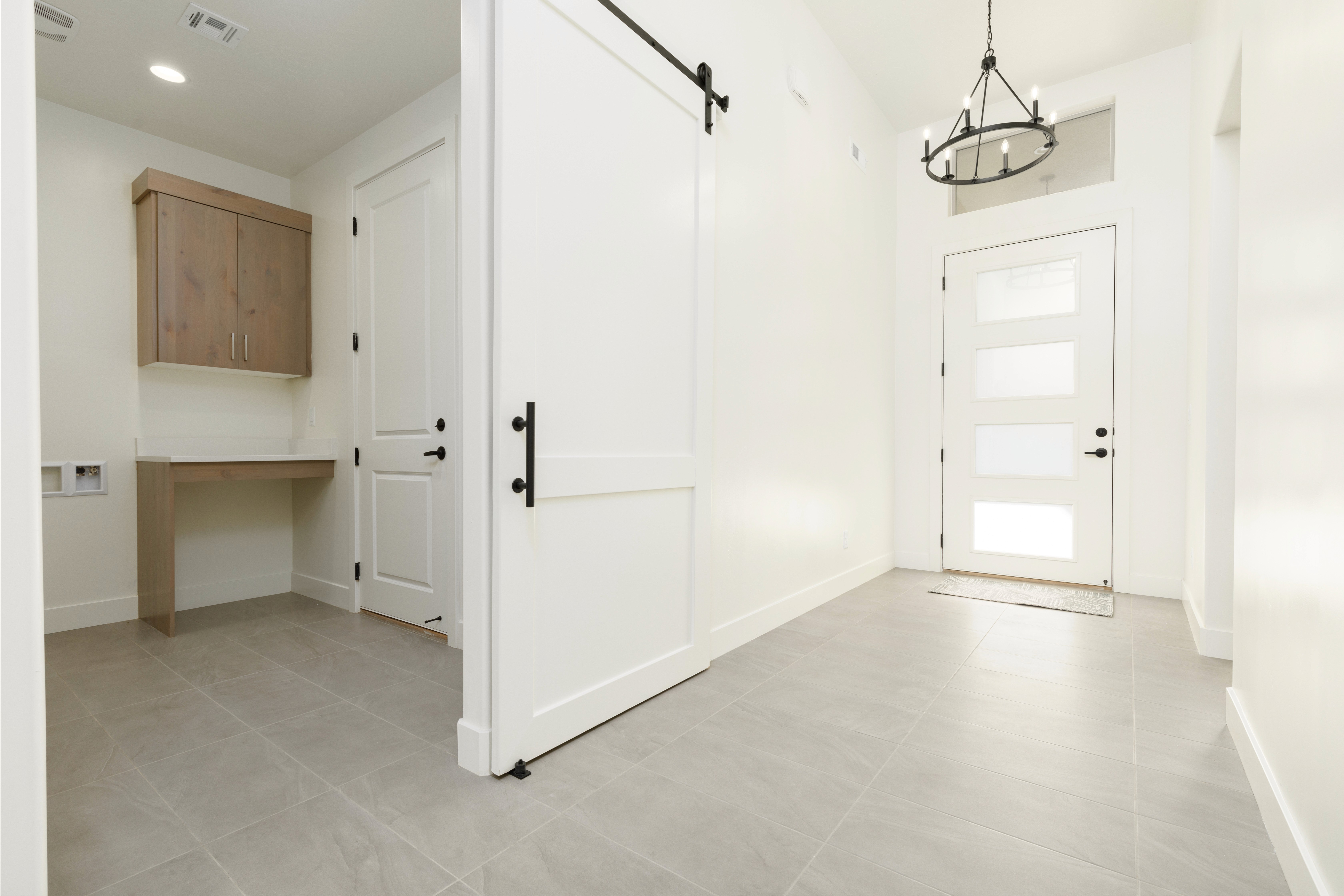 Entryway in a custom home with a chandlier in the entry in a Hurricane, Utah home.