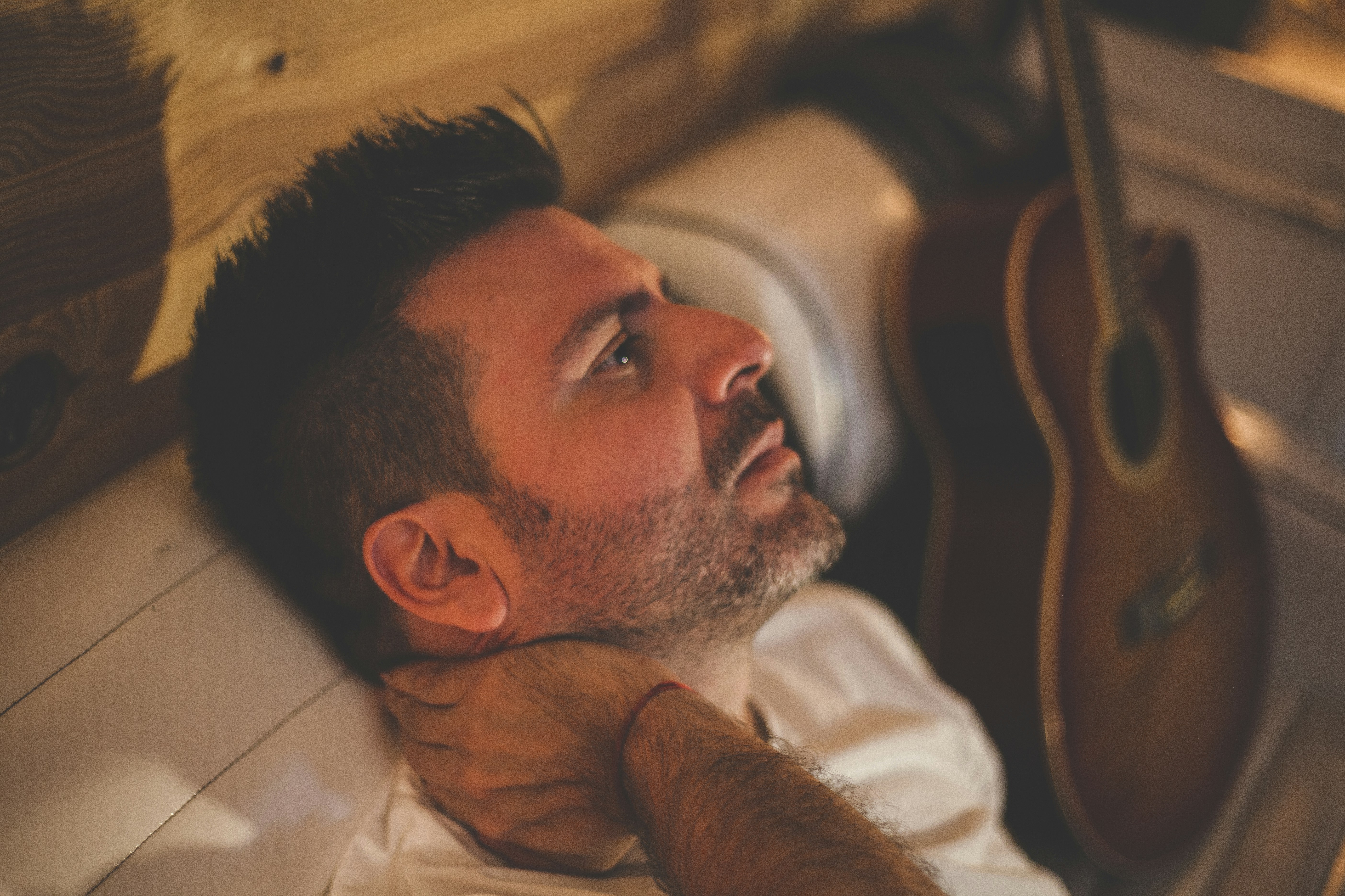 Frustrated guitar player on couch