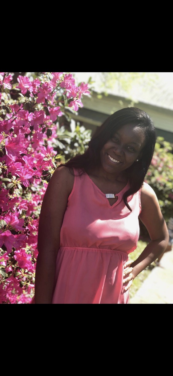 woman in white crew neck shirt smiling