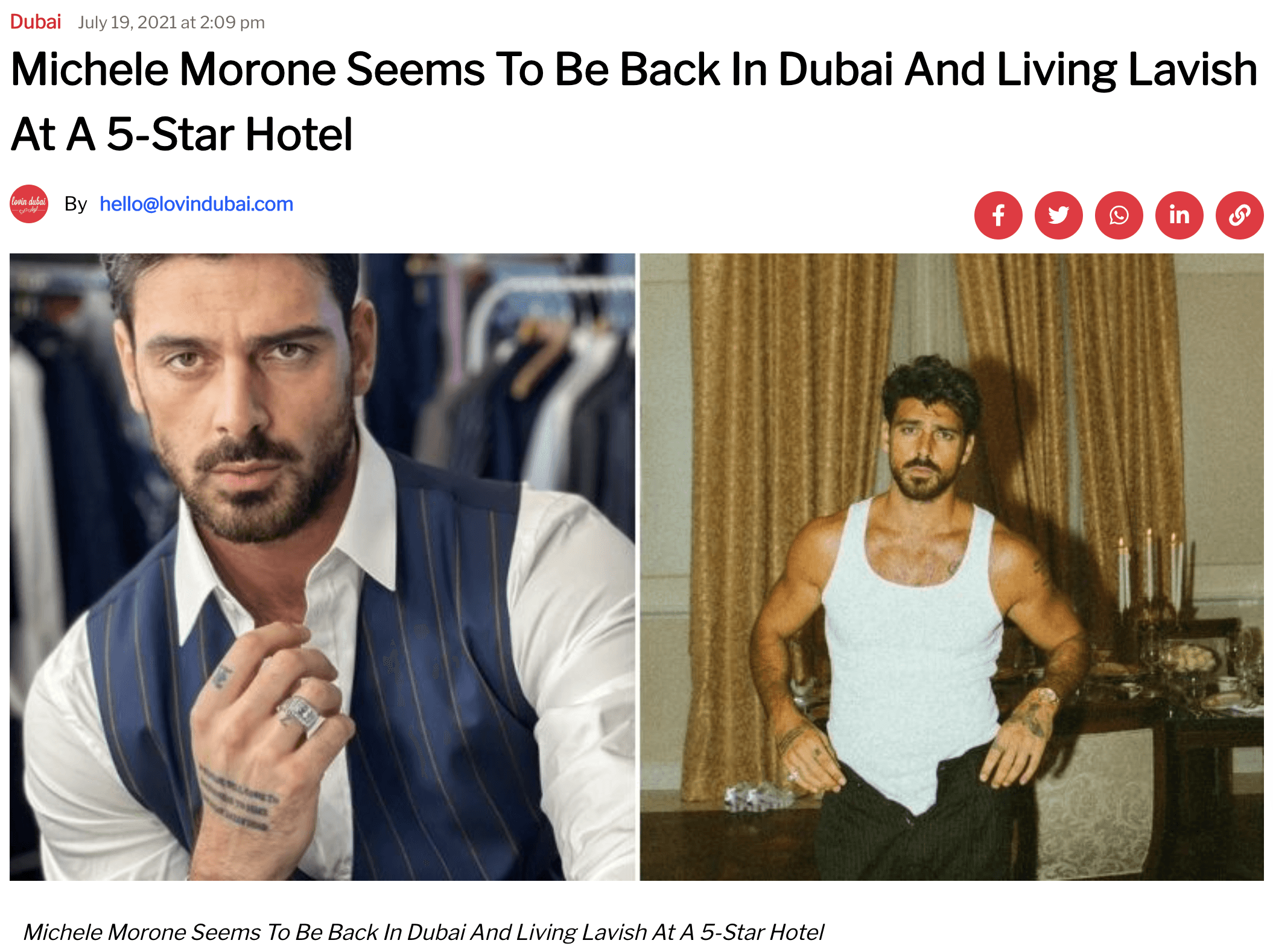 Black-and-white party photo of a smiling man in a check blazer among a crowd.
