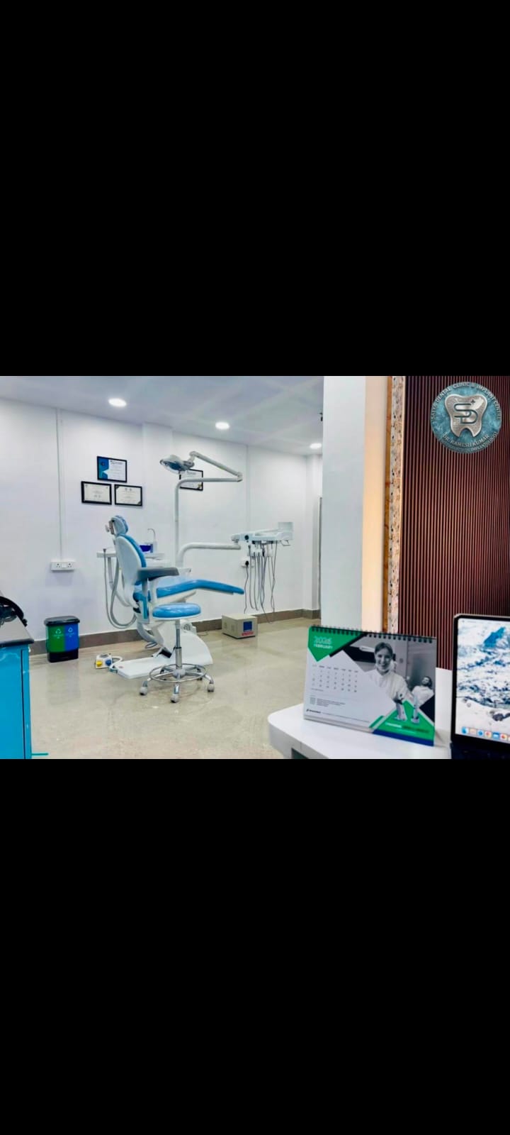 Dental clinic operatory and reception view